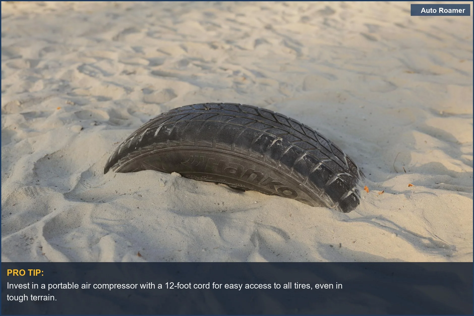 Car tire sinking into sand, emphasizing the importance of choosing a tire inflator for car camping.