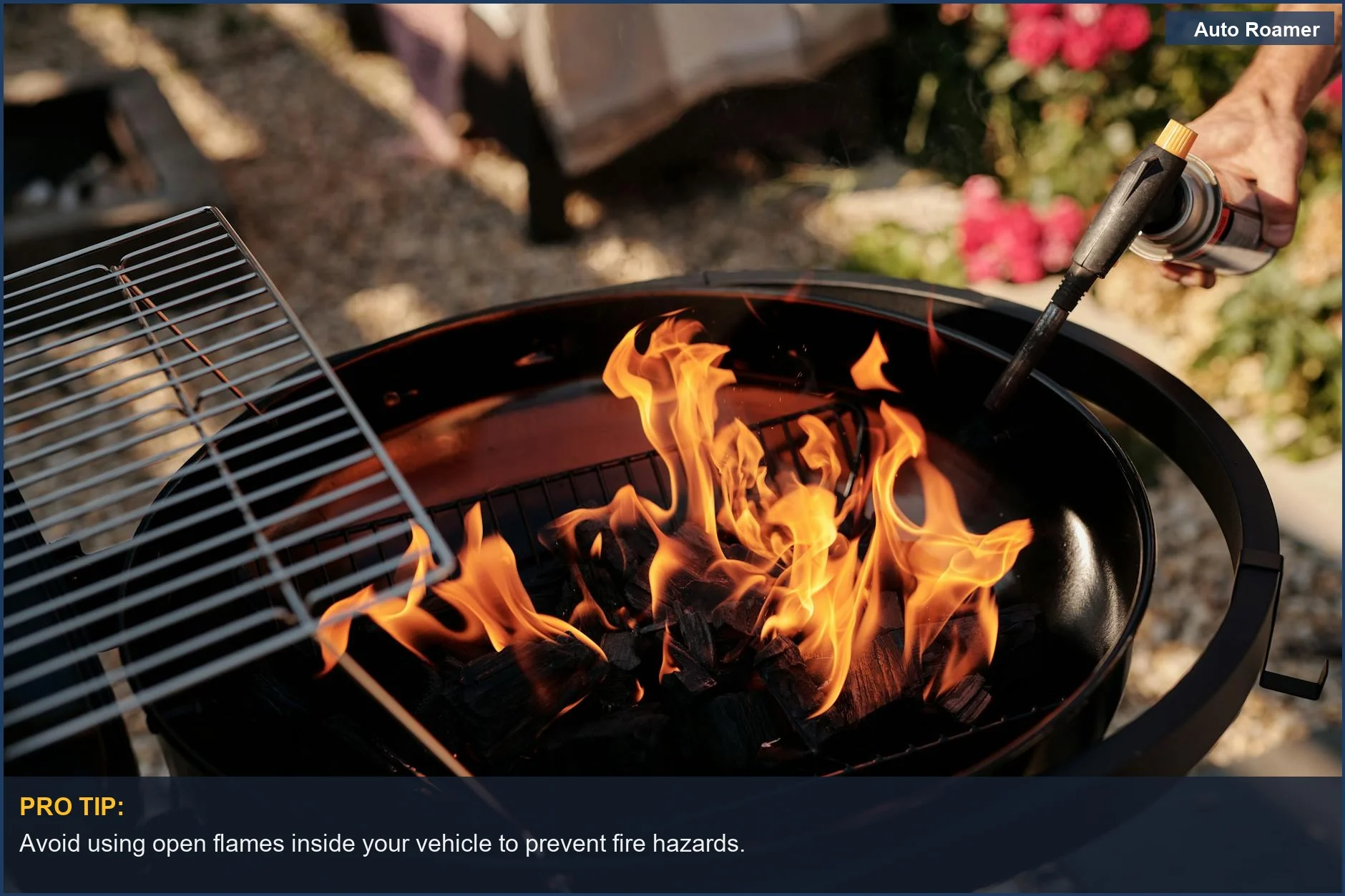 Charcoal grill ignited with flames, ready for outdoor cooking.