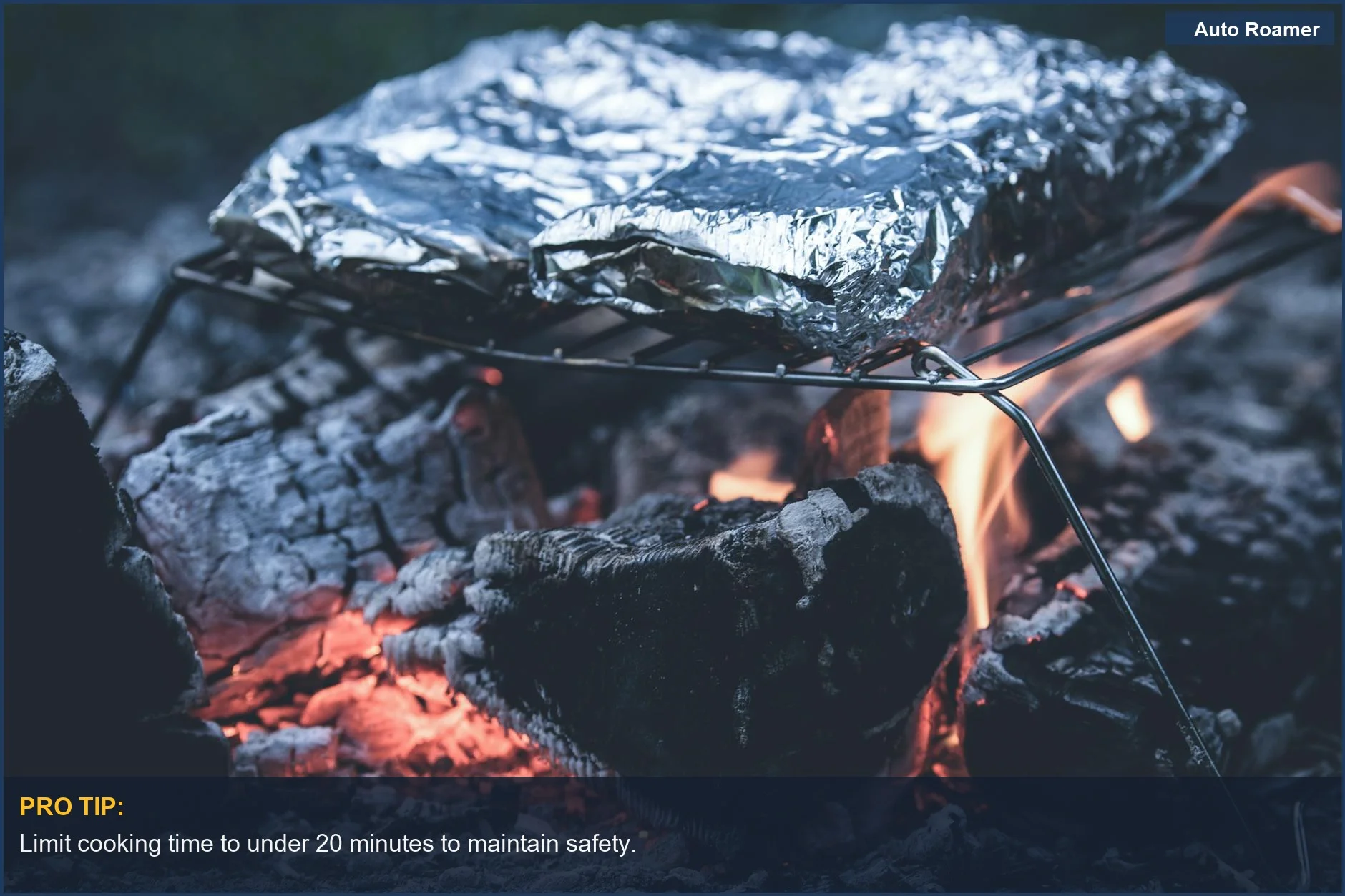 Foil-wrapped food grilling over an open flame on a portable stove.