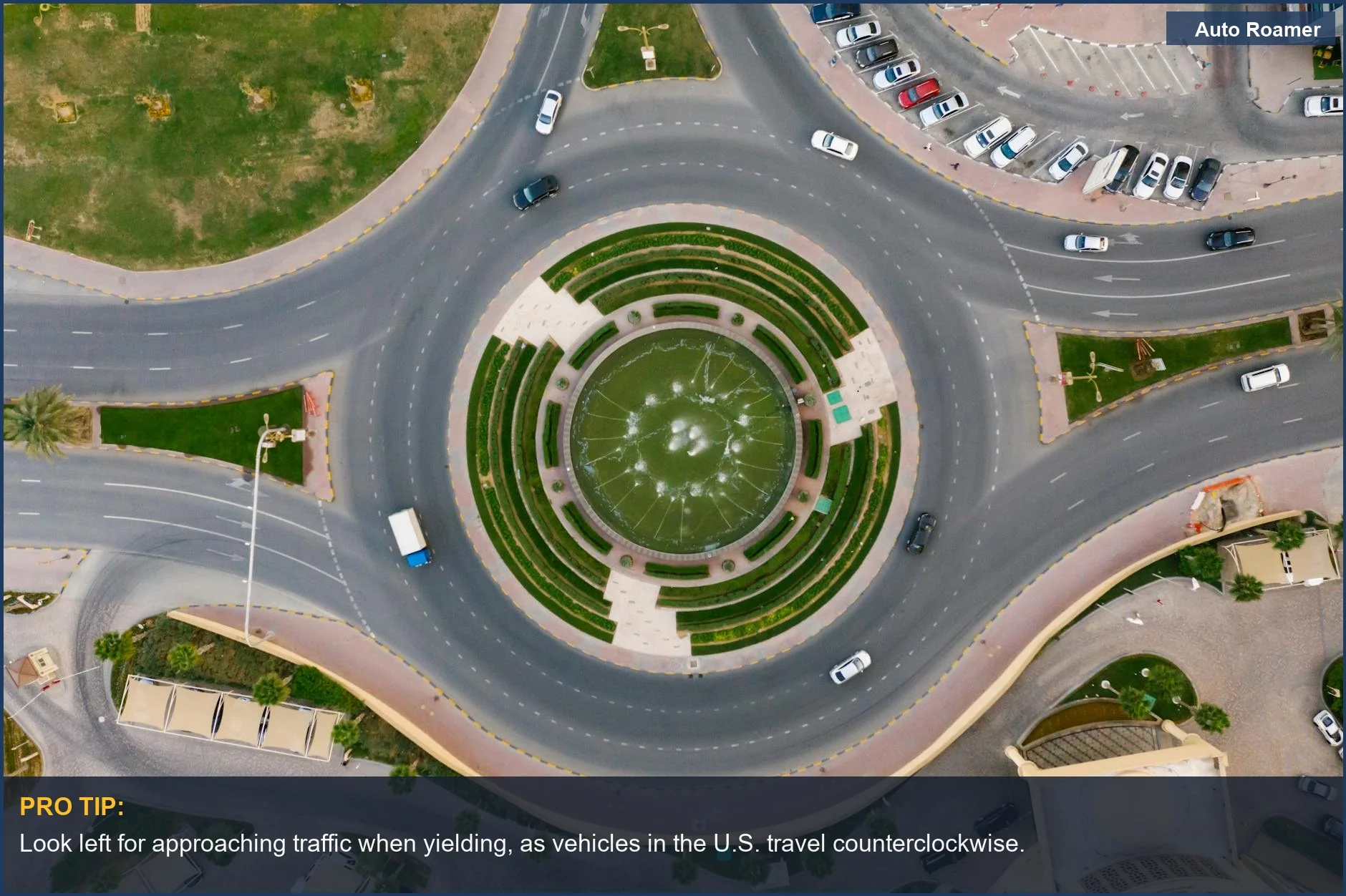 Modern circular urban roundabout with greenery and traffic flow, explaining how roundabouts work.
