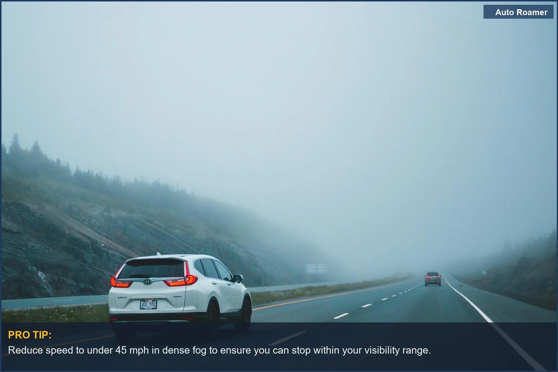 Cars navigate a foggy highway, emphasizing the need for reduced speed and careful fog driving.