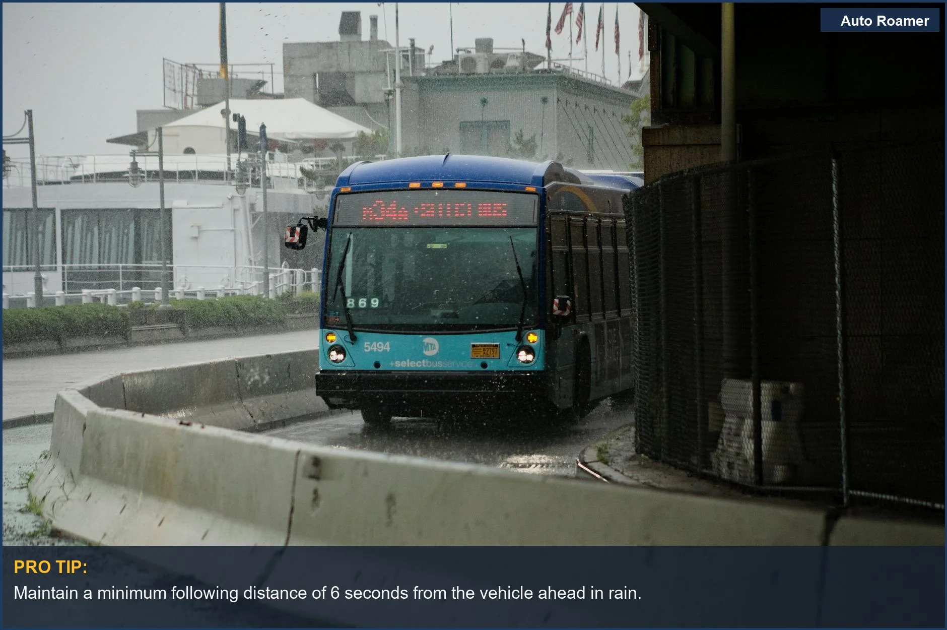 City bus navigating wet streets amid heavy rain, showcasing public transportation safety measures.