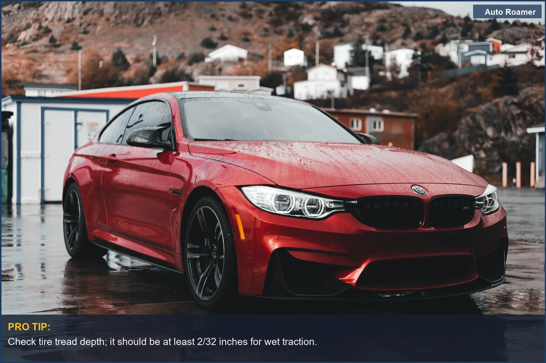 Red sports car parked on a wet urban street, highlighting vehicle preparation for rainy conditions.