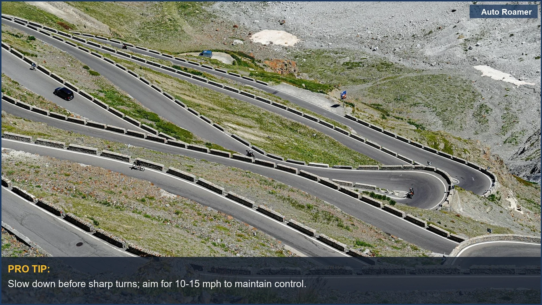 Aerial view of cyclists and a vehicle navigating a winding mountain road safely