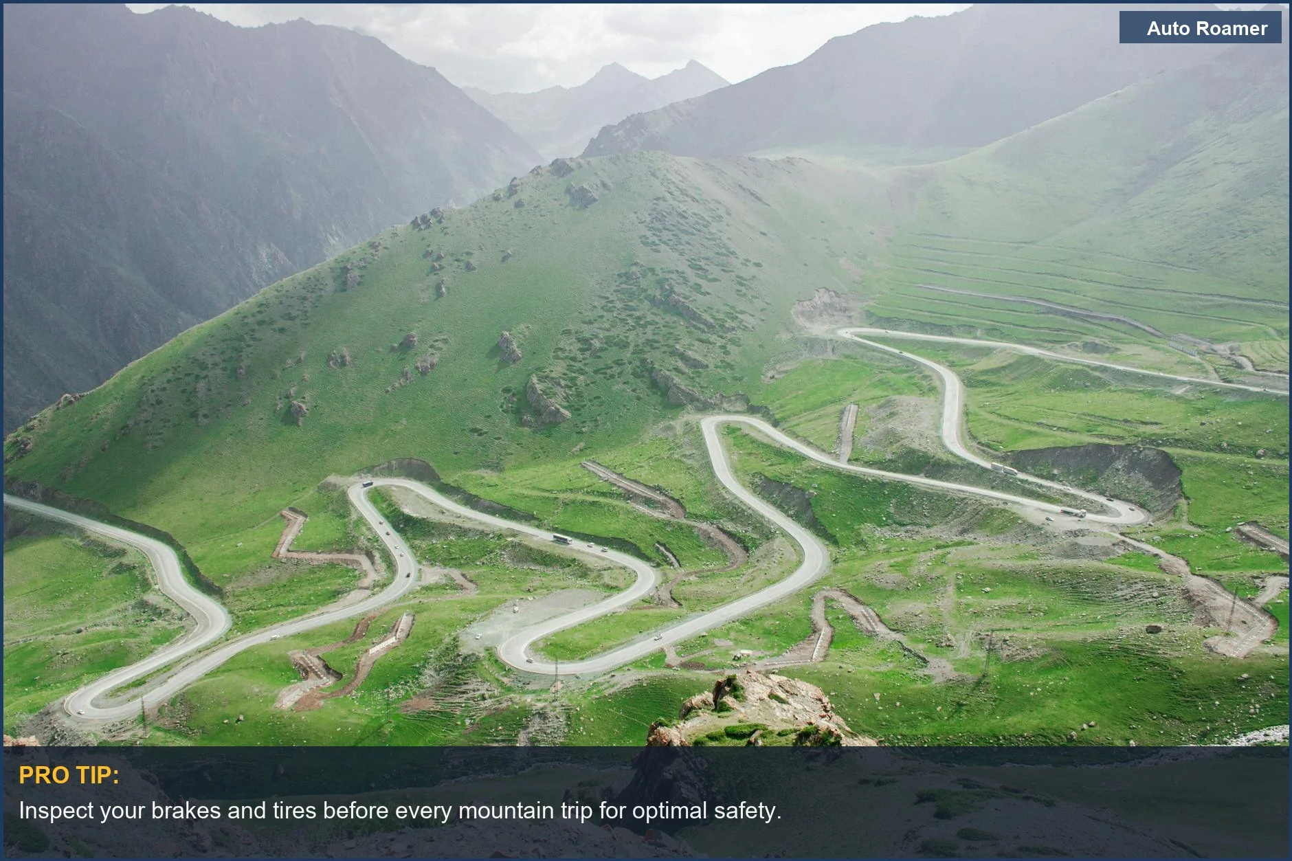Lush green hills alongside a winding mountain road for safe driving tips