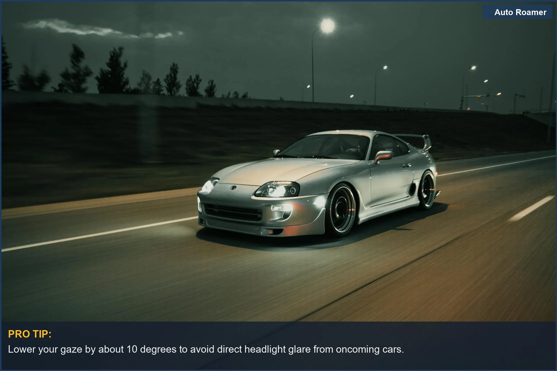 Silver sports car driving at night, its headlights piercing the darkness for safe travel.