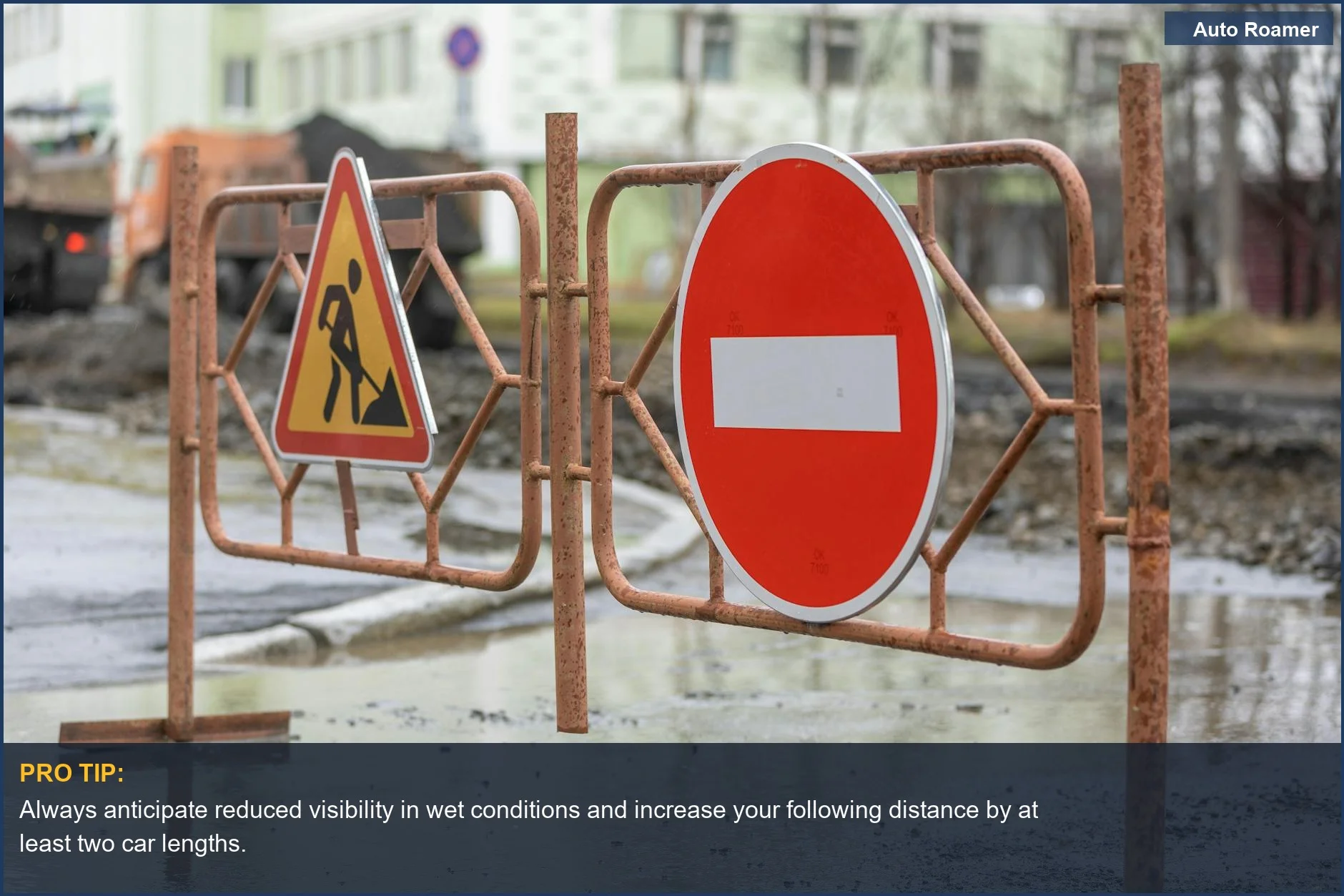 Rainy highway construction zone with no entry sign, emphasizing construction zone driving safety.