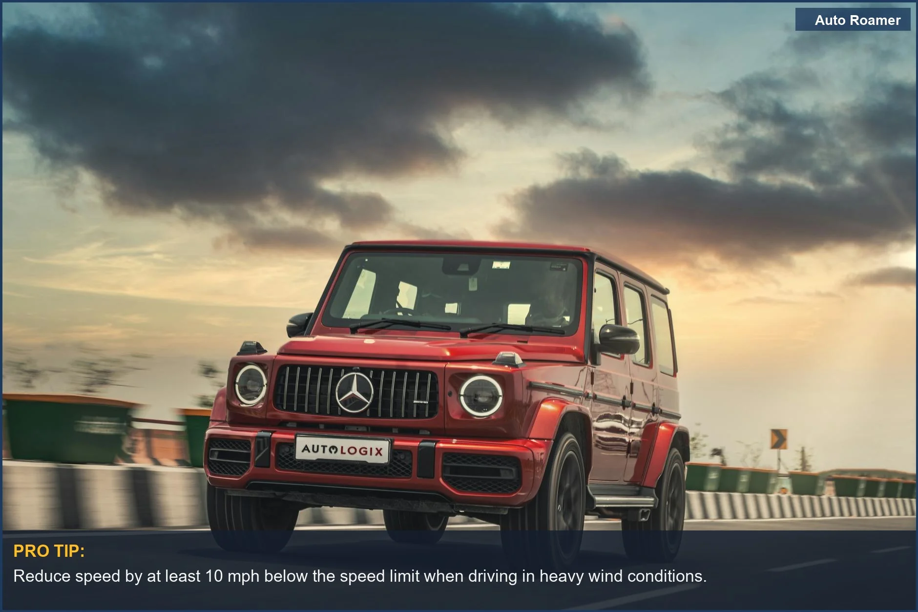 Red luxury SUV driving on an open road under a dramatic cloudy sunset sky, illustrating high wind driving.