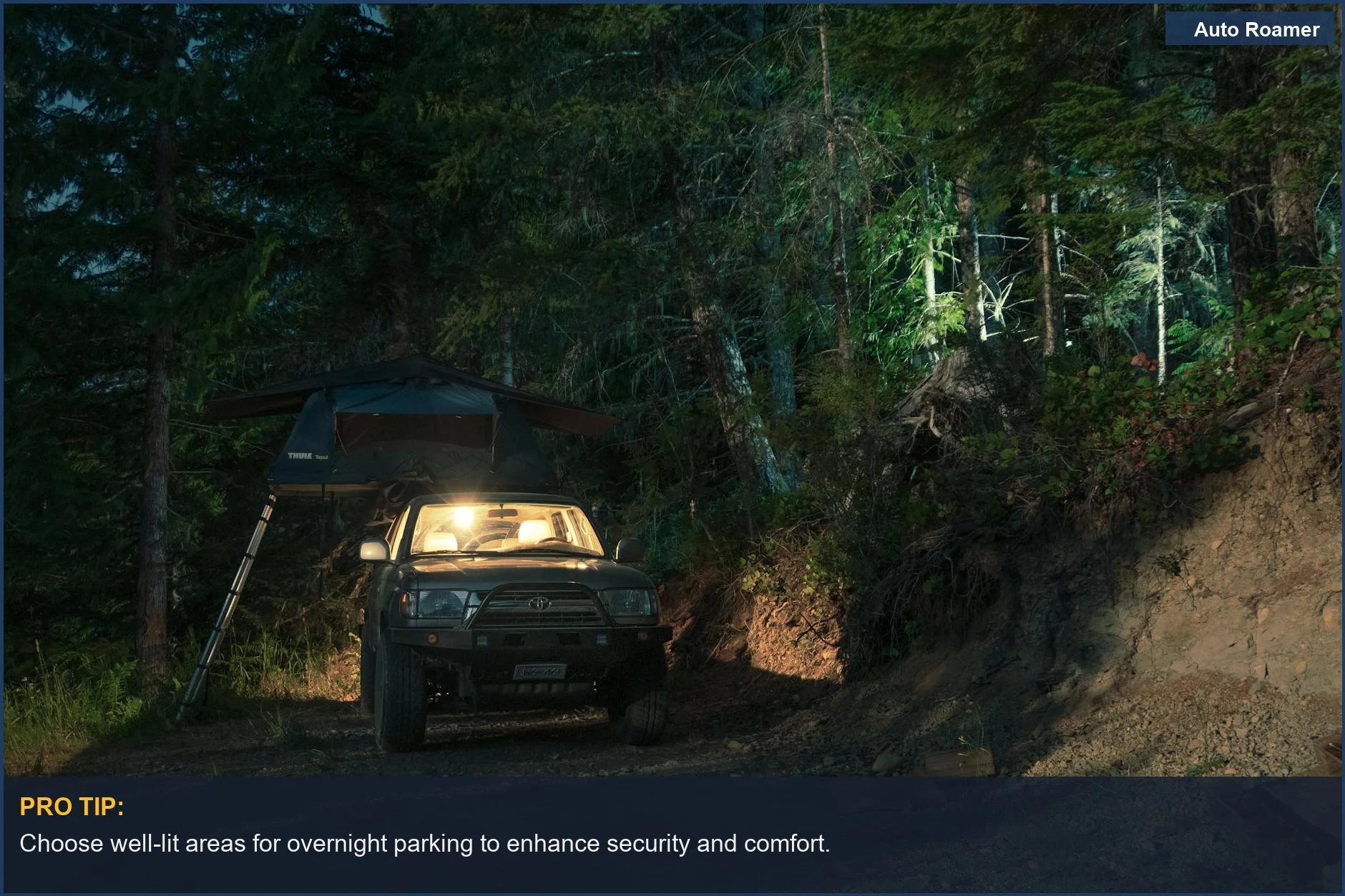 SUV with rooftop tent parked in a dimly lit forest campsite at night.