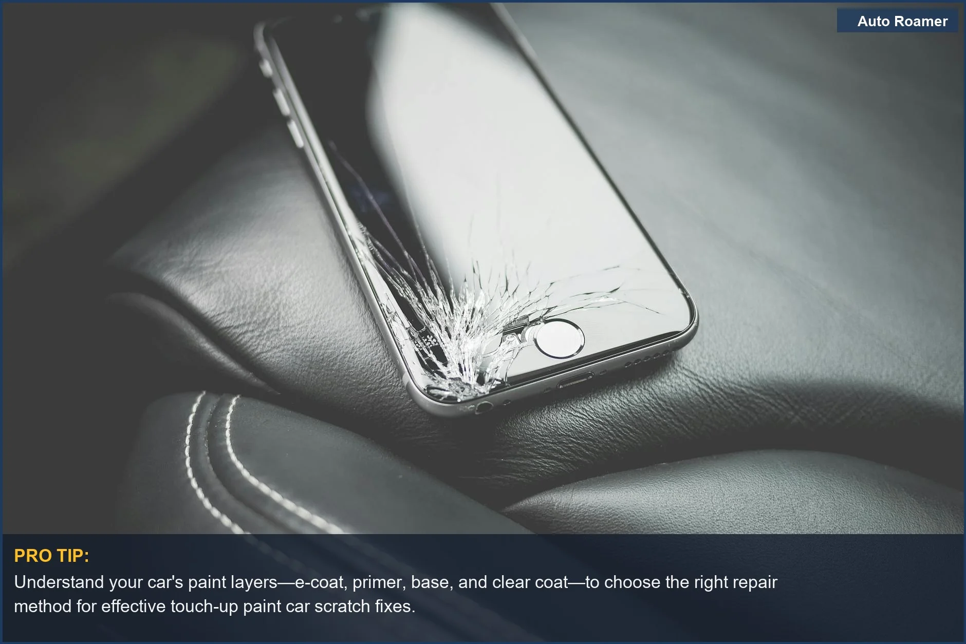 Cracked smartphone screen on a car seat, symbolizing the frustration of damaged surfaces and the importance of understanding car paint layers for repair.