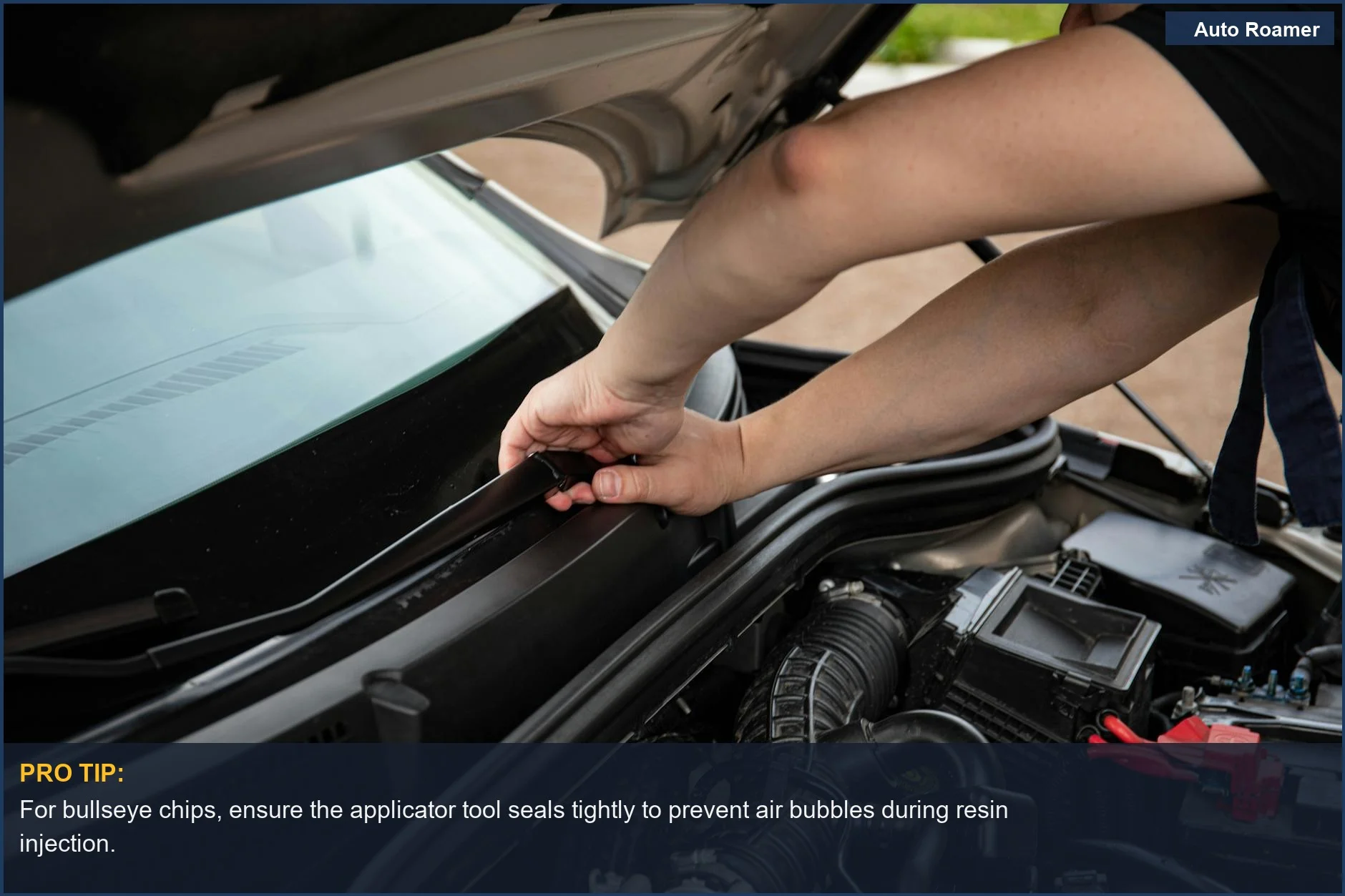 Close-up of a car windshield with a bullseye chip, perfect for windshield chip repair kit instructions.
