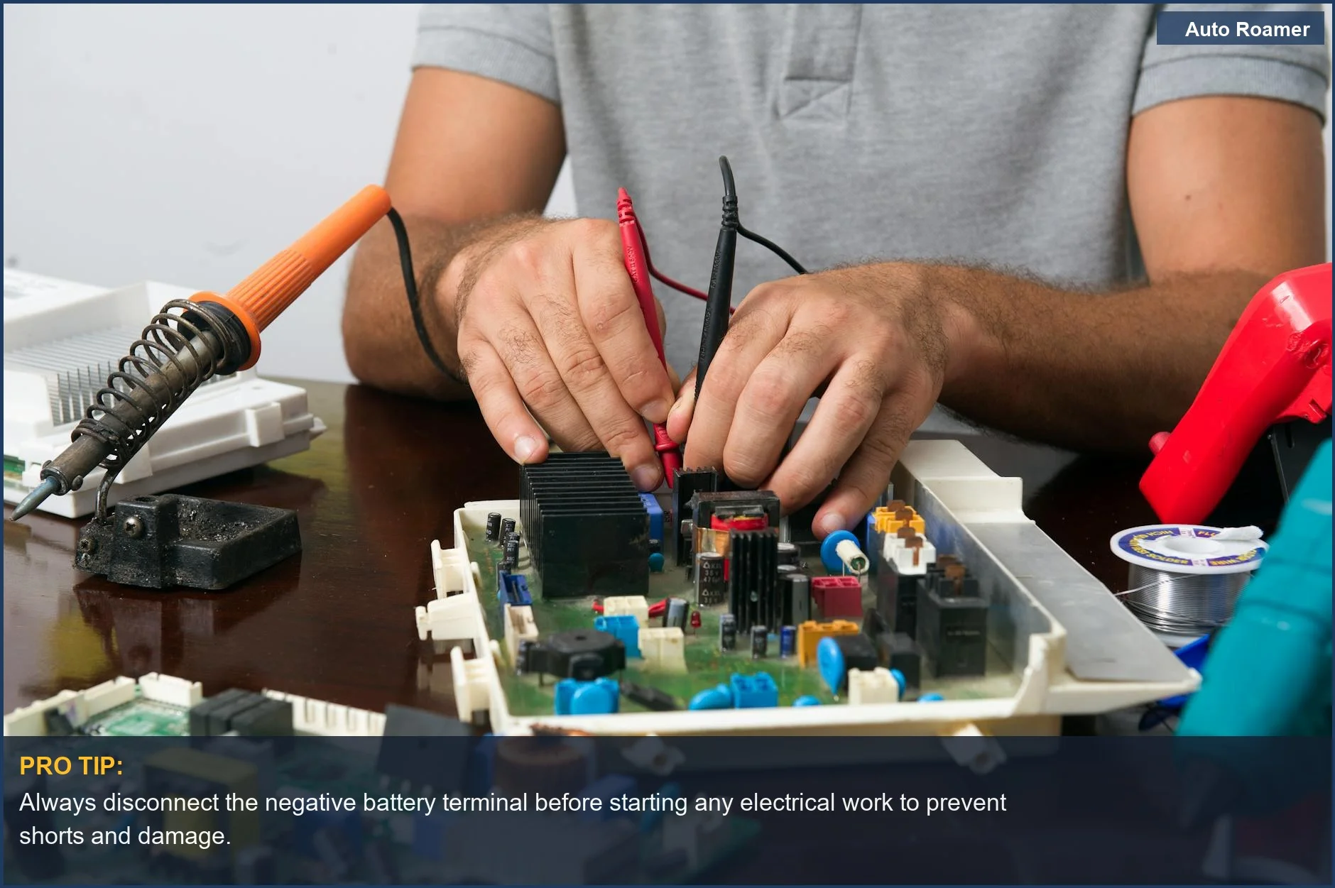 Man's hands meticulously working on electronic components on a circuit board, demonstrating off-grid dashcam installation.