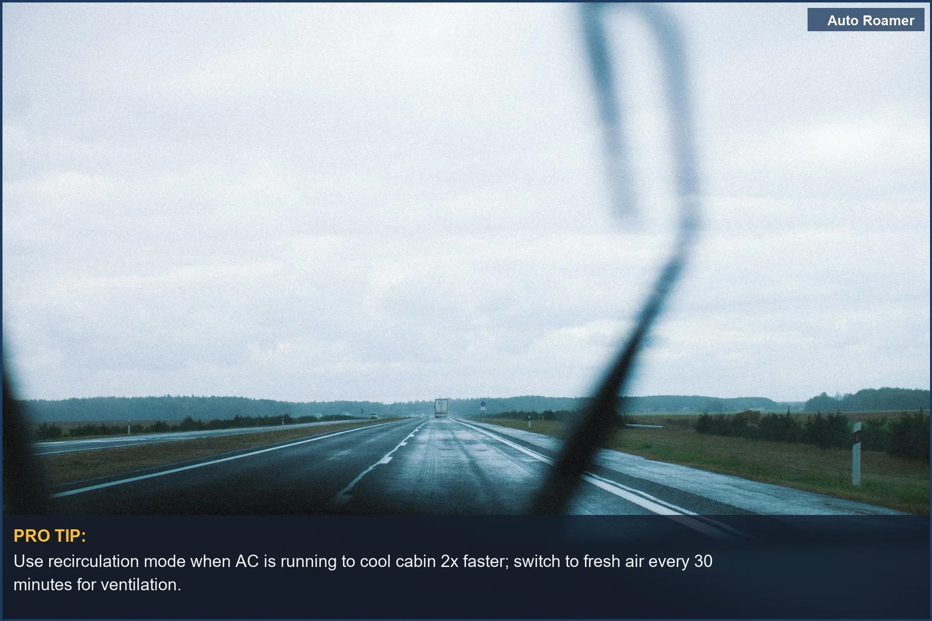View of a long, wet highway through a rainy car windshield, emphasizing the need for better car AC for road trips safety.