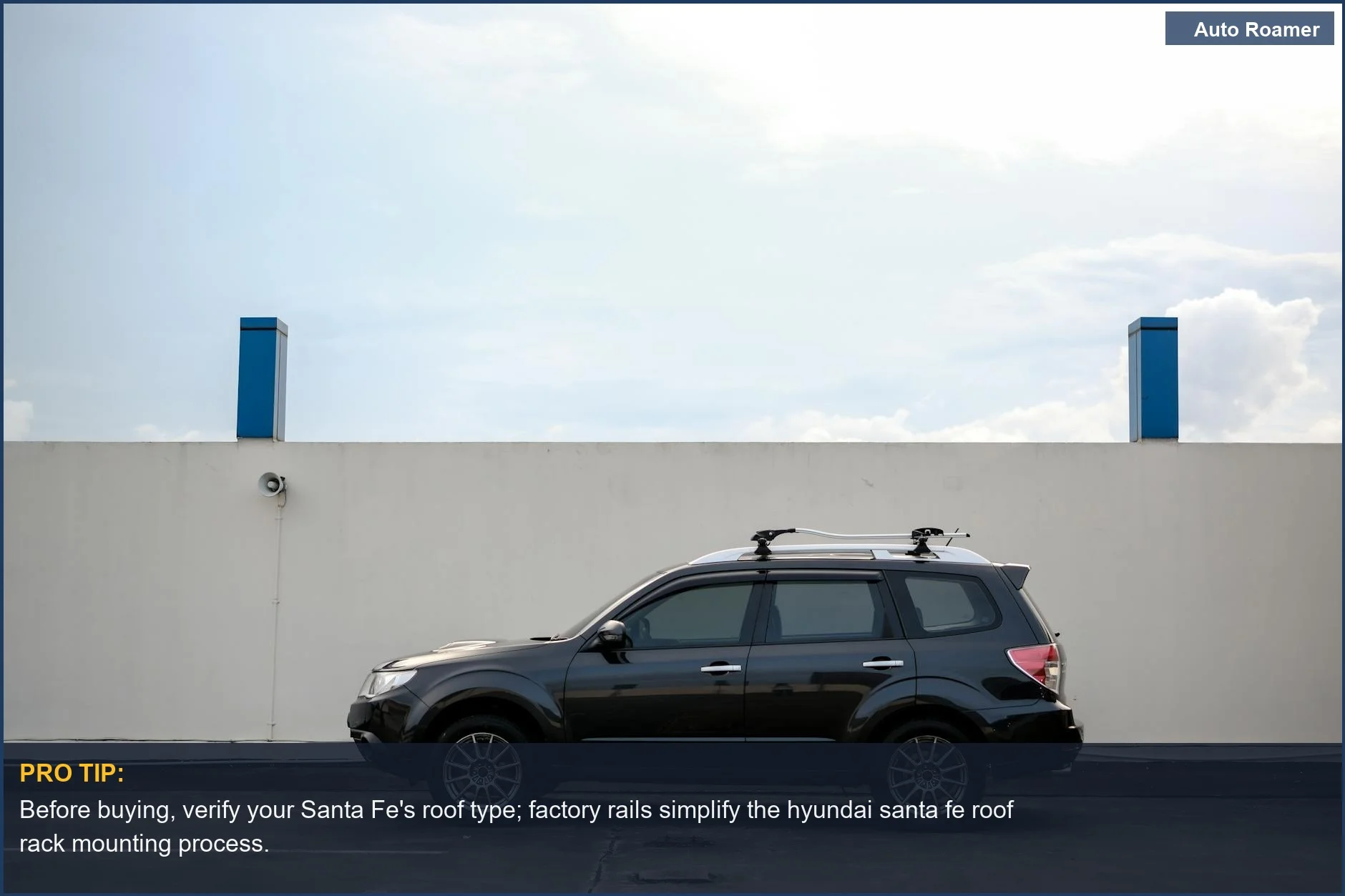 Side profile of a black Hyundai Santa Fe SUV parked, showcasing its potential for roof rack installation.