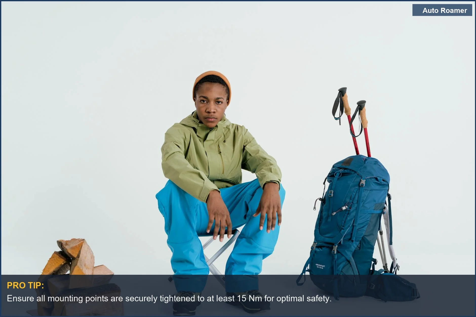 Young man with a hiking backpack ready to load gear onto a Hyundai Santa Fe roof rack.