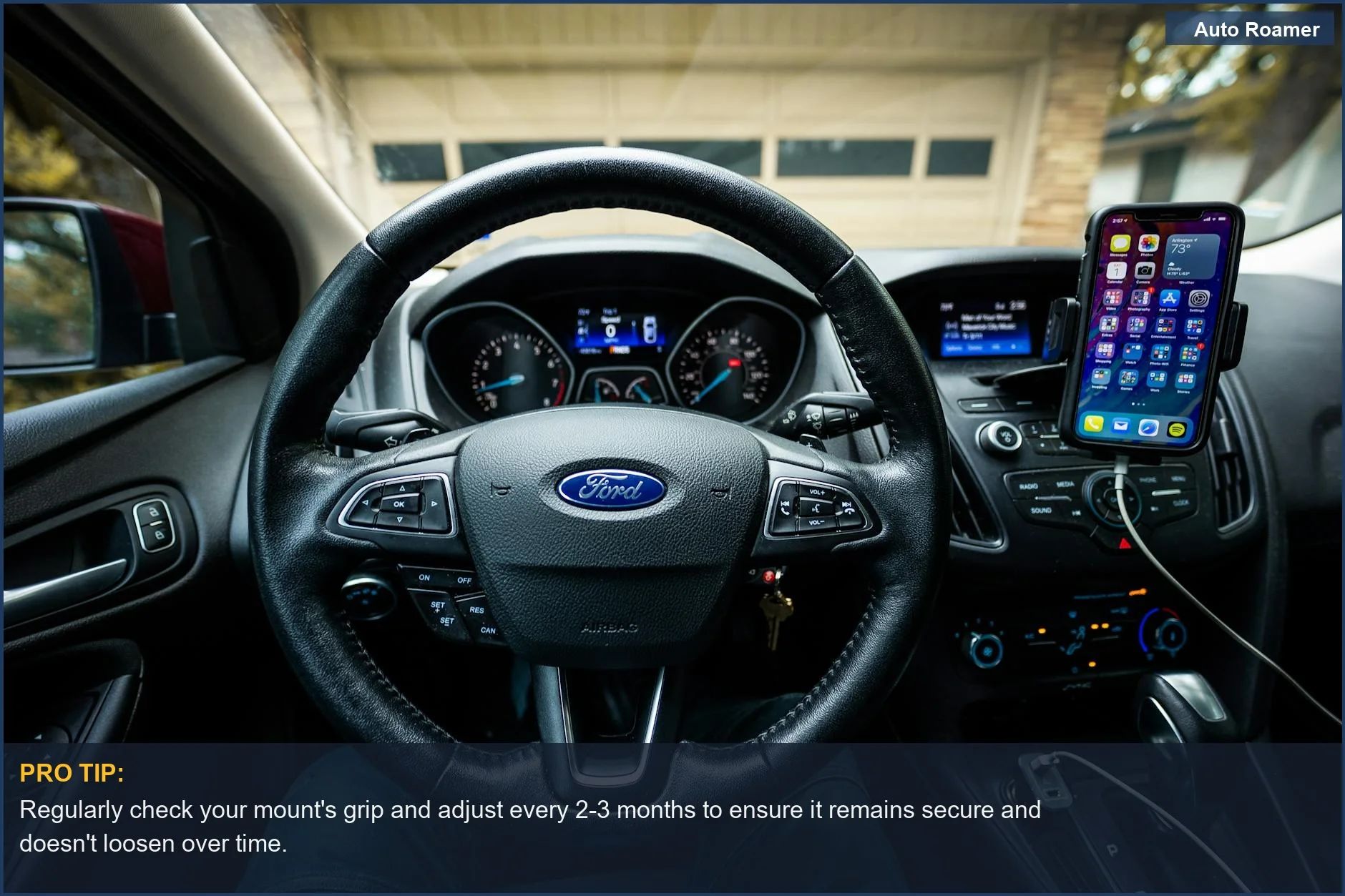 From inside a Ford car, the dashboard, steering wheel, and a mobile mount are seen, helping prevent car damage from phone mount.