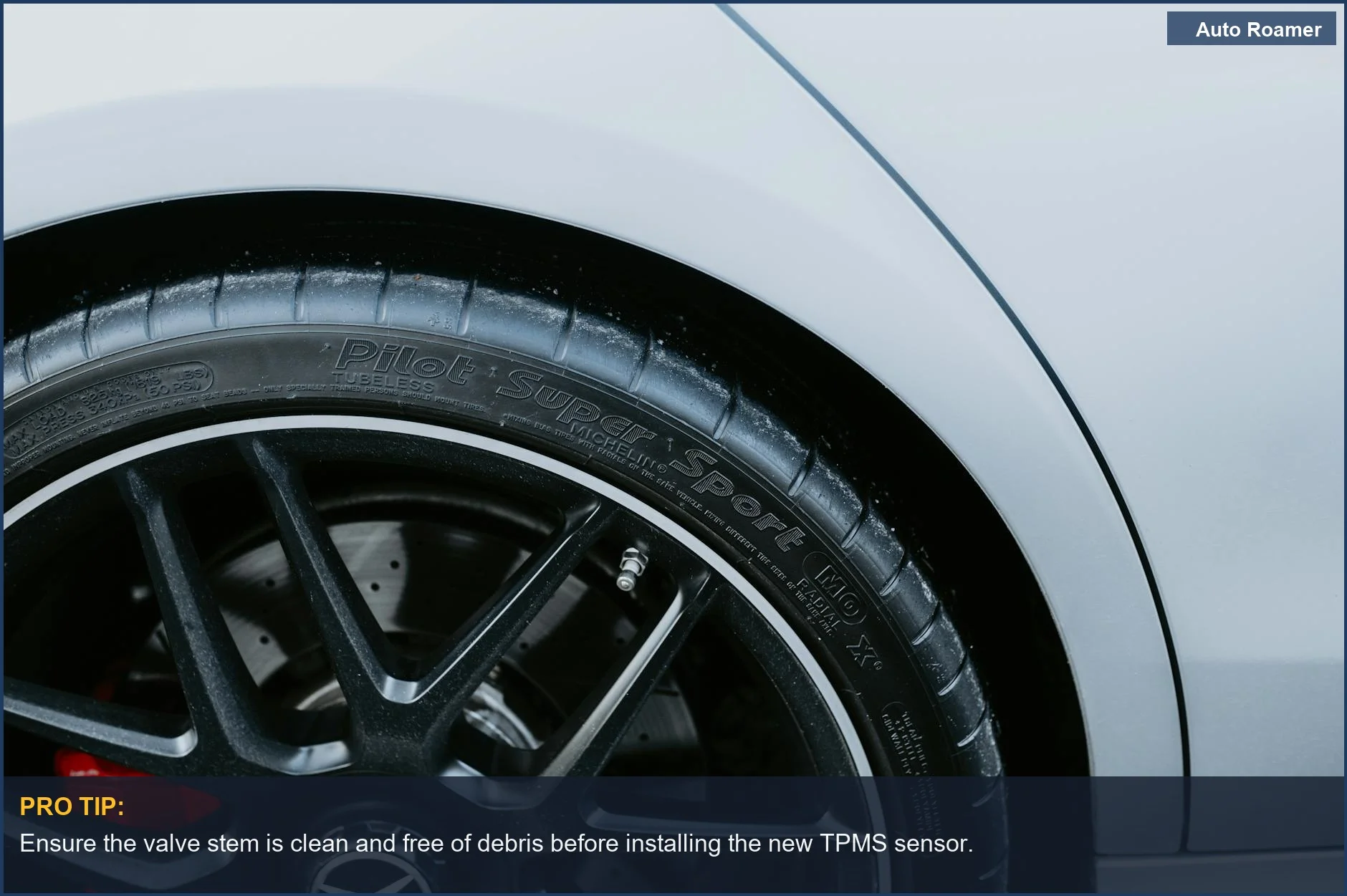 Close-up of a car's alloy wheel and tire, highlighting the area for TPMS sensor mounting.
