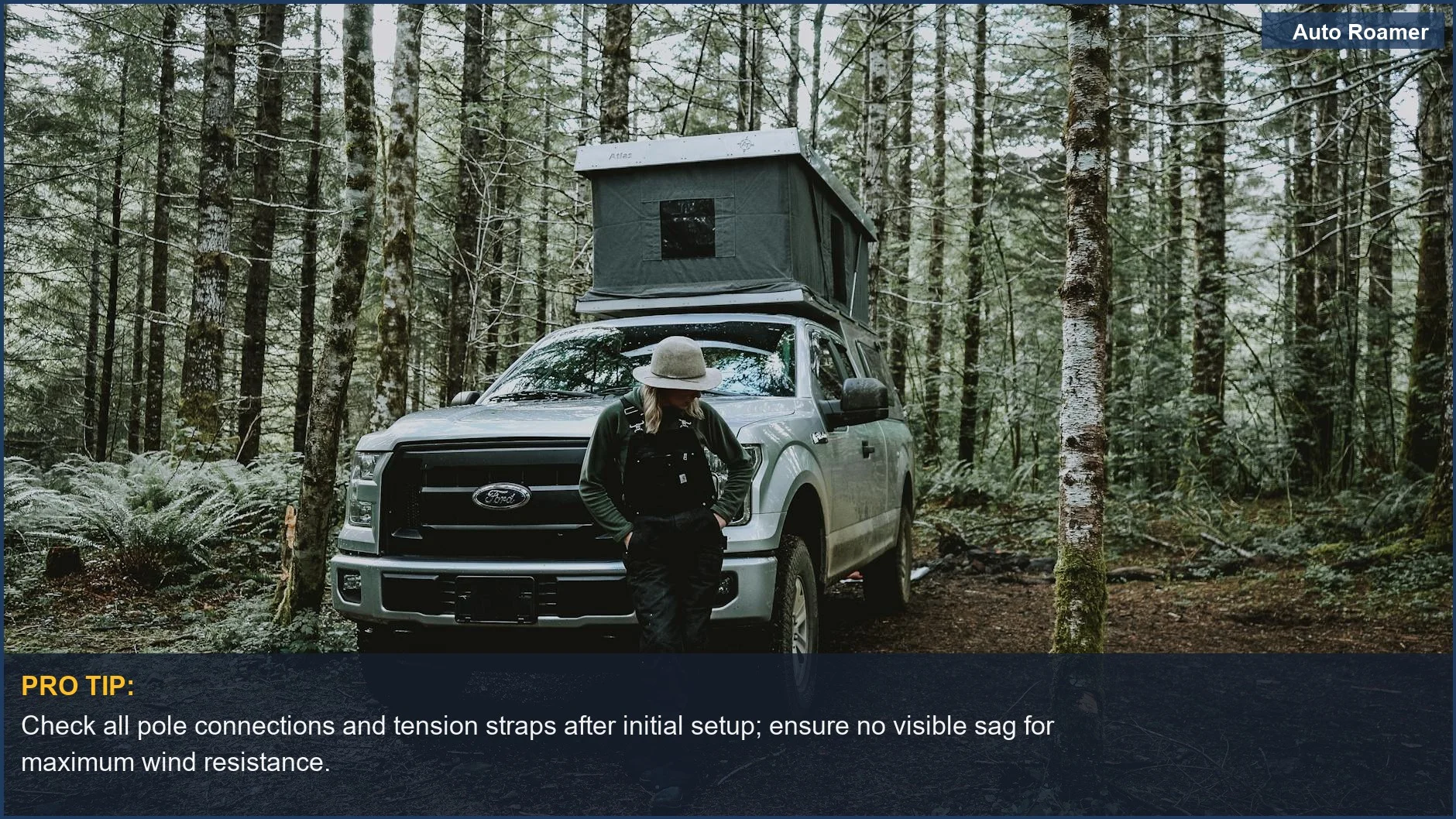 Woman camping in Oregon woods with a pickup truck tent, enjoying the travel lifestyle.