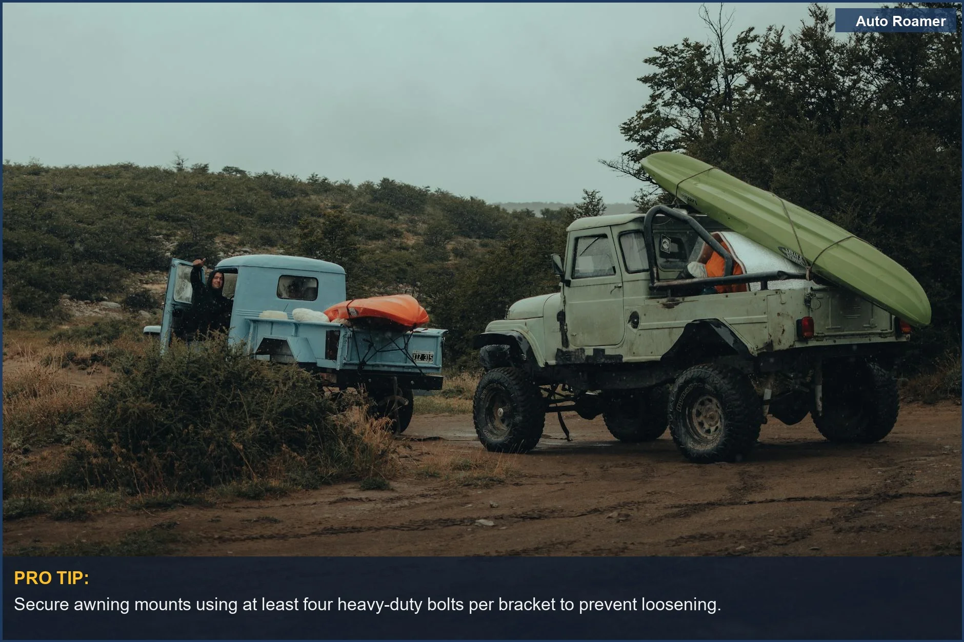 Two 4x4 trucks with kayaks, prepared for a rugged off-road journey and awning installation.