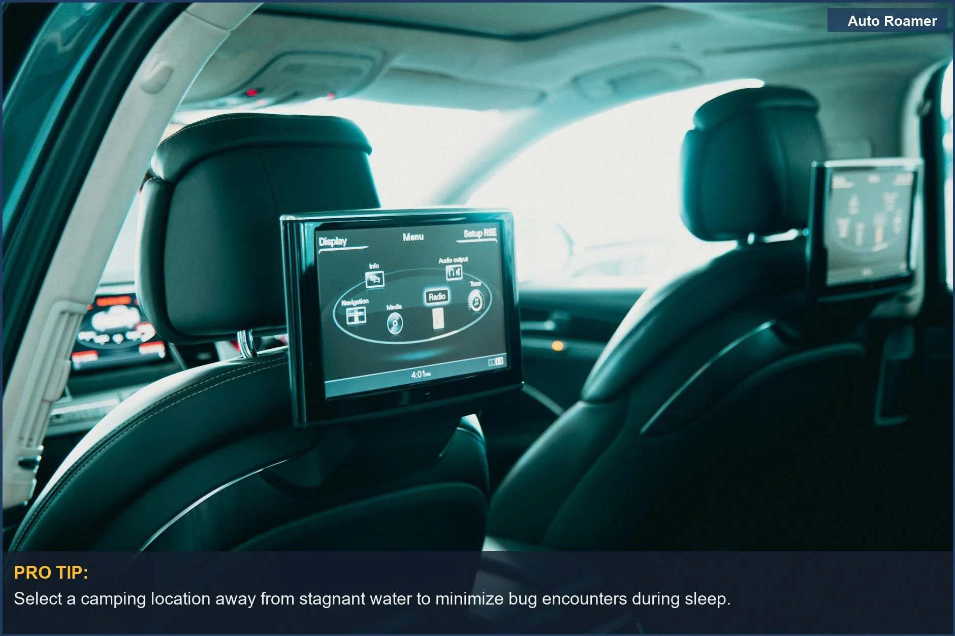 Spacious car interior with entertainment screens, perfect for bug-free sleeping.