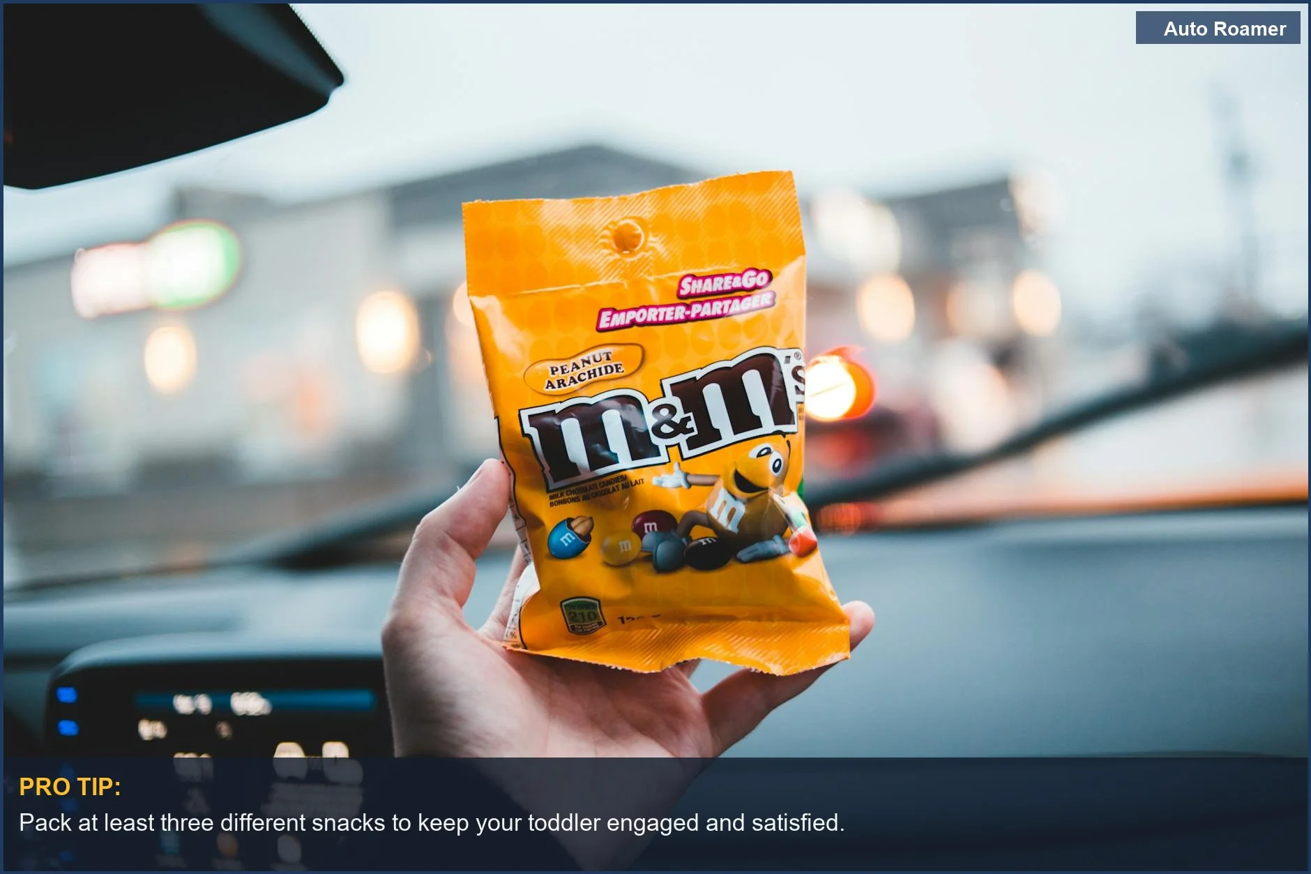 Anonymous person enjoying colorful candies to entertain toddlers during long car rides.