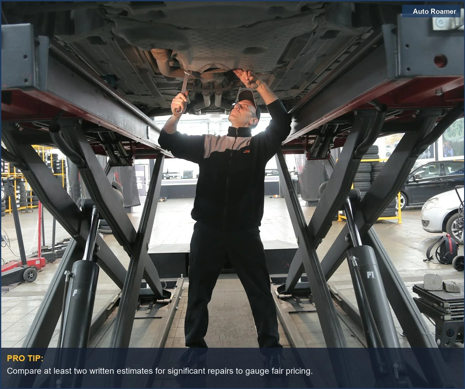 Professional auto garage inspecting a vehicle, essential for determining if your mechanic is overcharging.