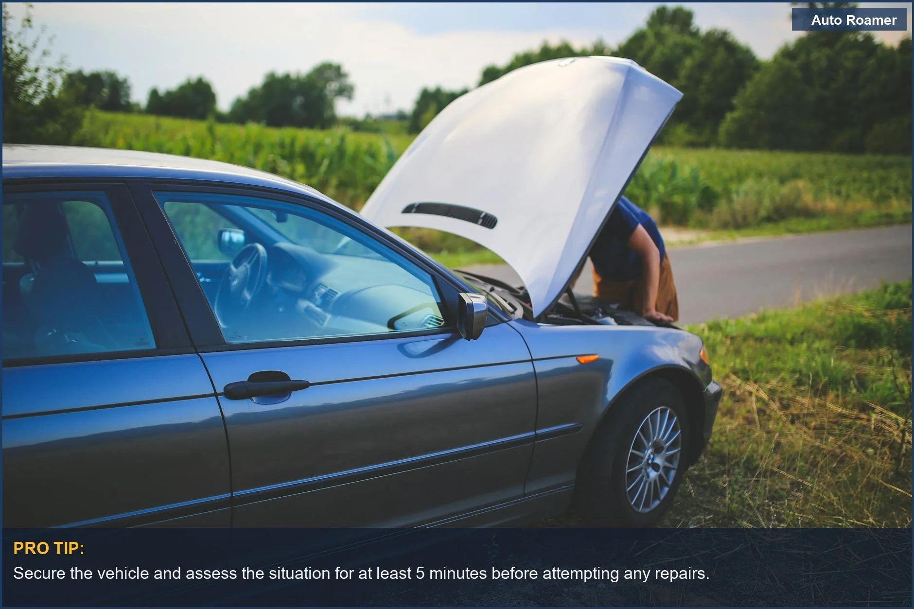 Man checks a car engine with the hood open on the side of a rural road during a trip.