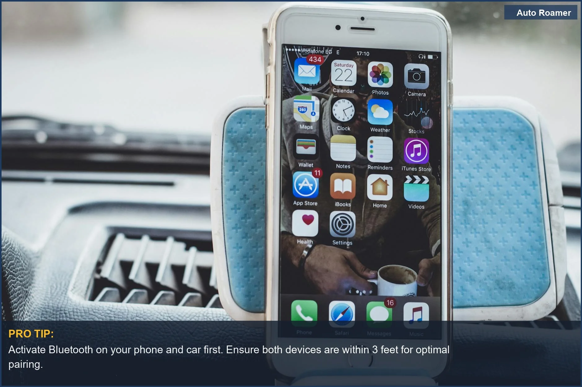A smartphone mounted on a car dashboard with apps displayed, illustrating the first step to pair phone with car bluetooth system.