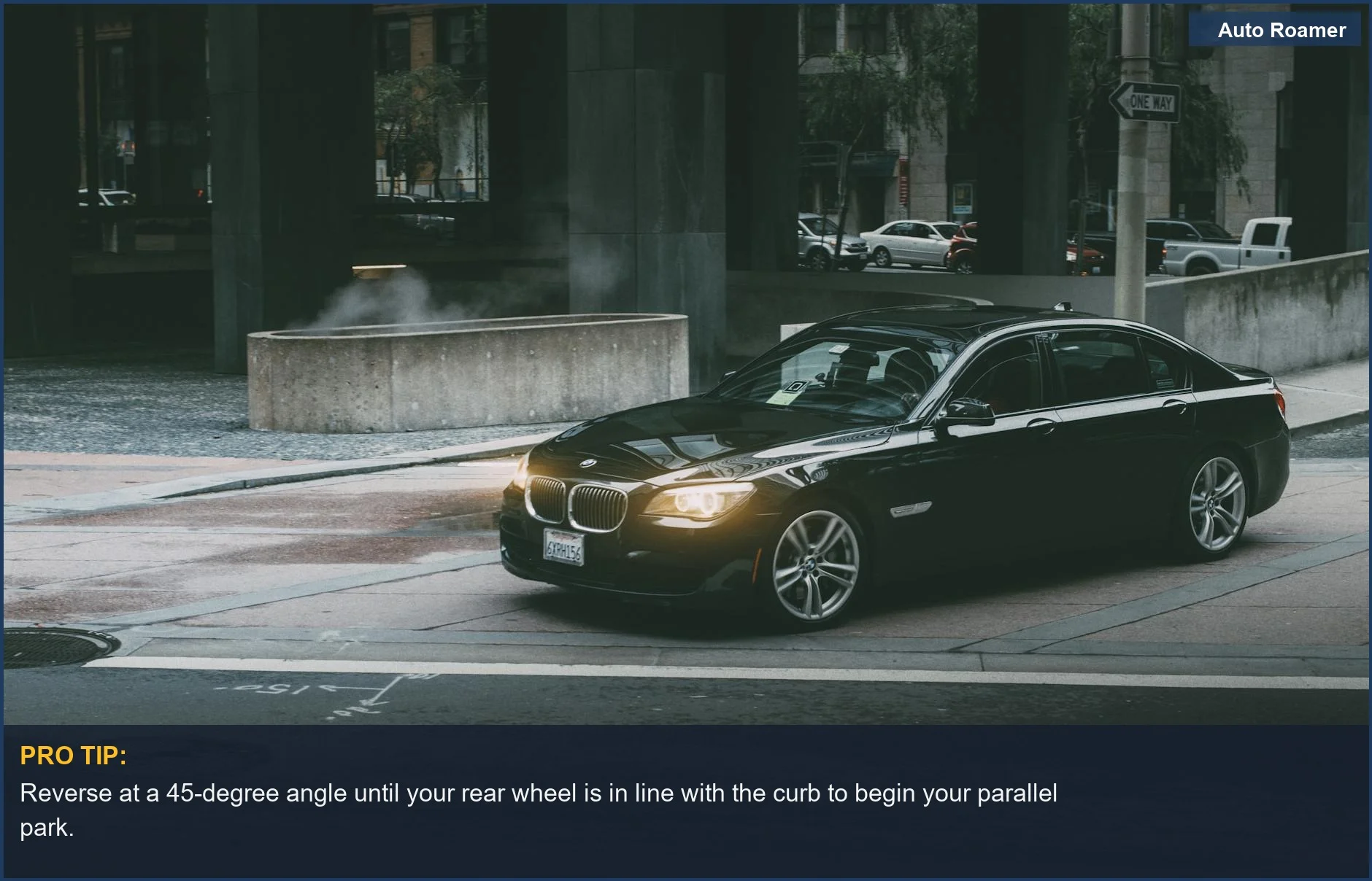 Black luxury car navigating city streets at twilight, illustrating the challenge of parallel parking in low light.