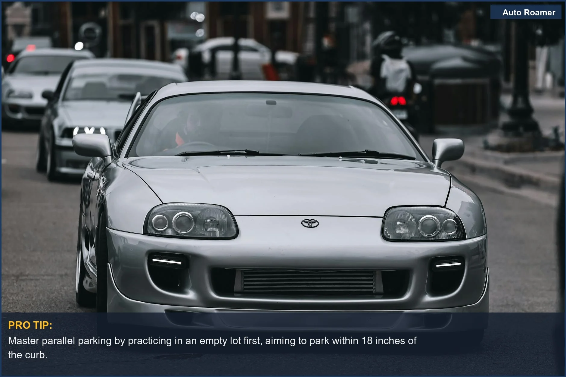 Sleek silver Toyota Supra cruising urban streets, demonstrating the beauty of parallel parking in a city.