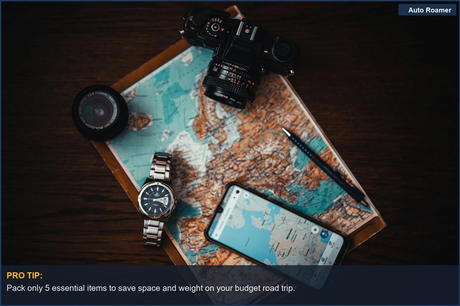 Top view of travel essentials for a budget road trip across the US on wood.