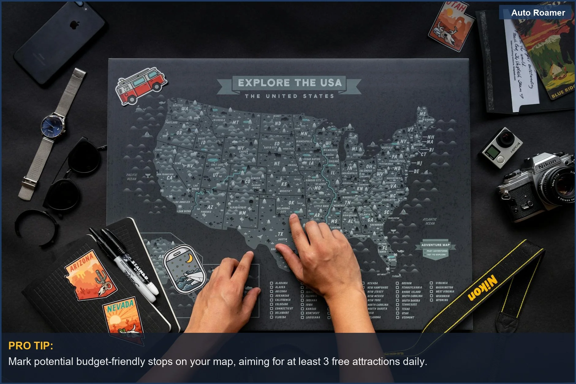 Hands interacting with a USA map and travel essentials for budget road trips.