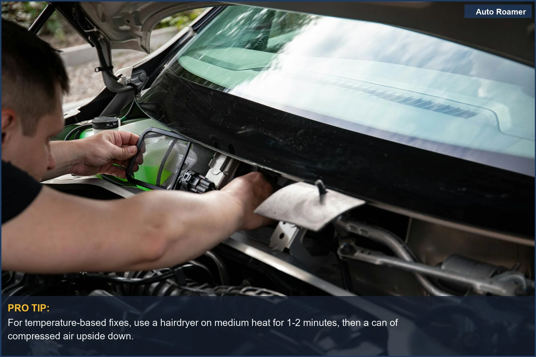 Close-up of a mechanic's hands working on a car engine, relevant to DIY car dent removal techniques.