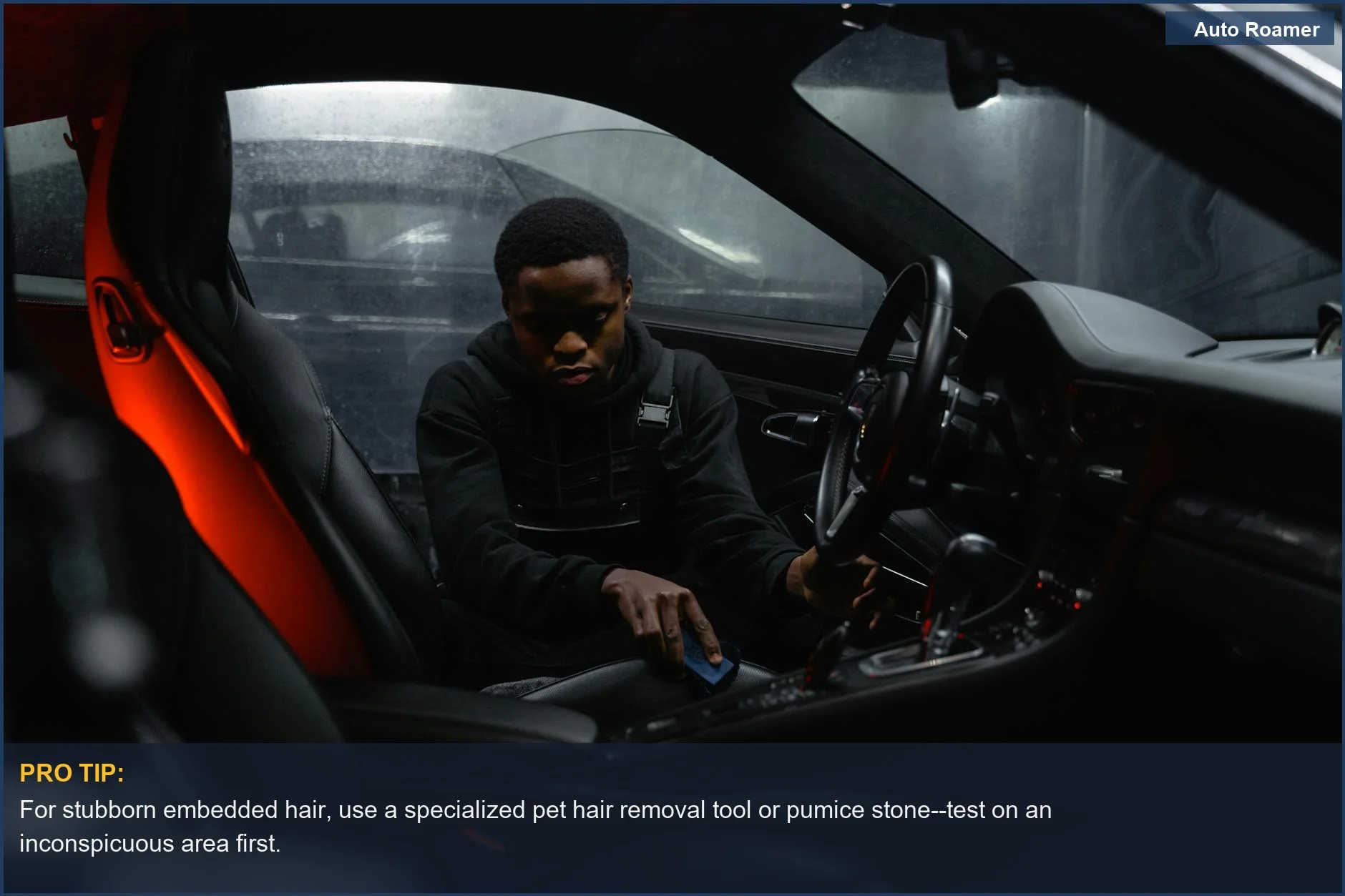 This image shows a man meticulously cleaning pet hair from car seats and interior surfaces in a luxury vehicle.