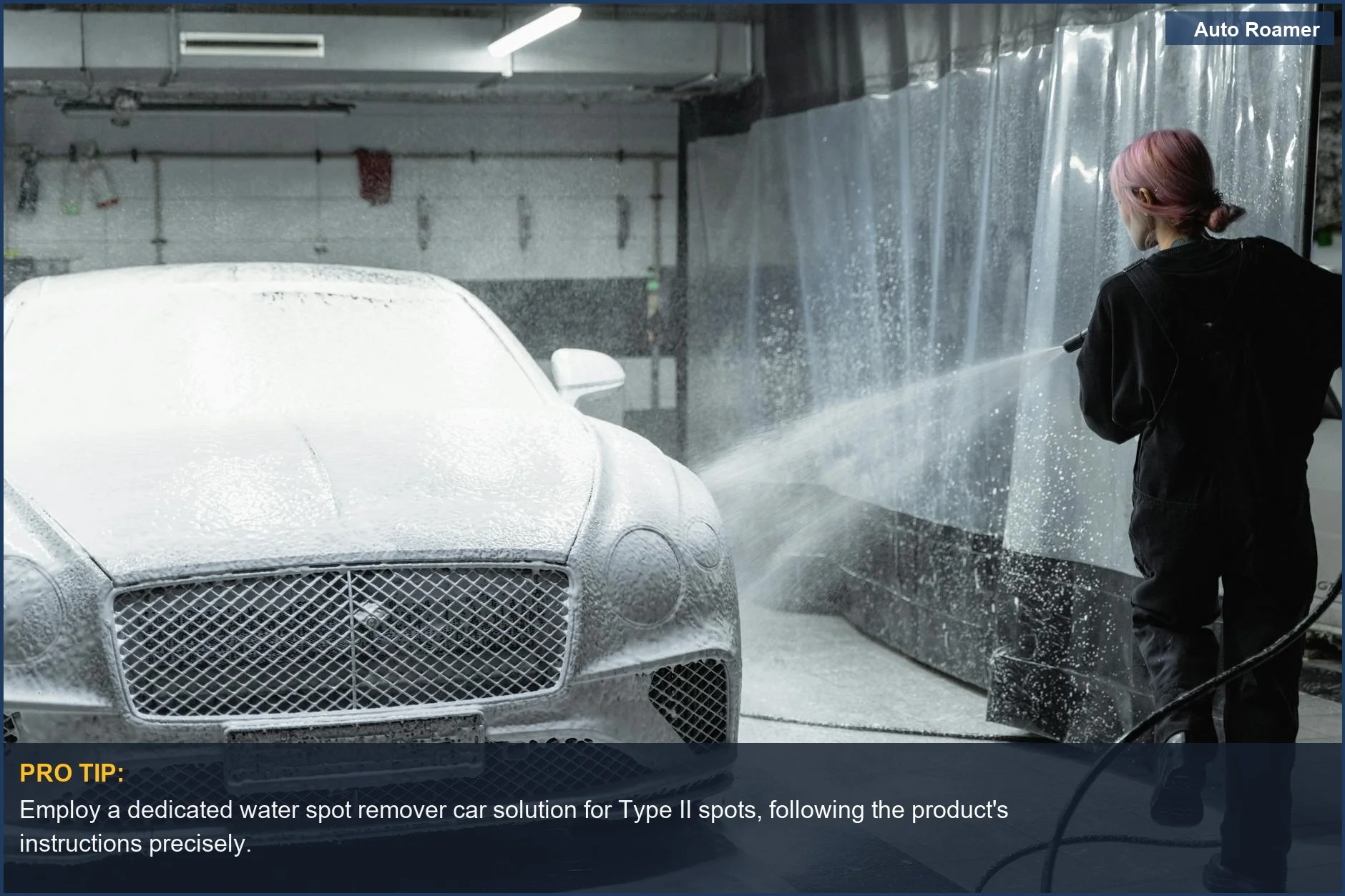 Woman pressure washing a car indoors, demonstrating professional methods for tackling stubborn water spots.