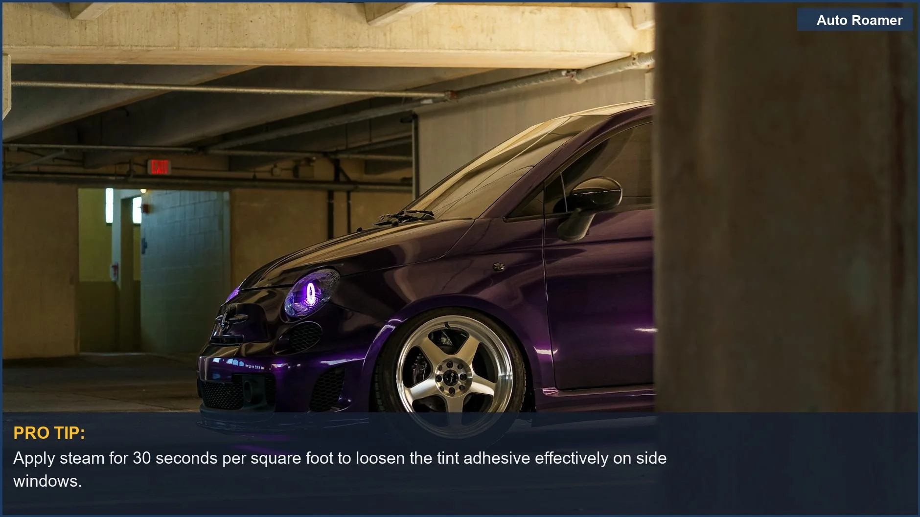 Side window of a car being steamed during the process to remove window tint from car.