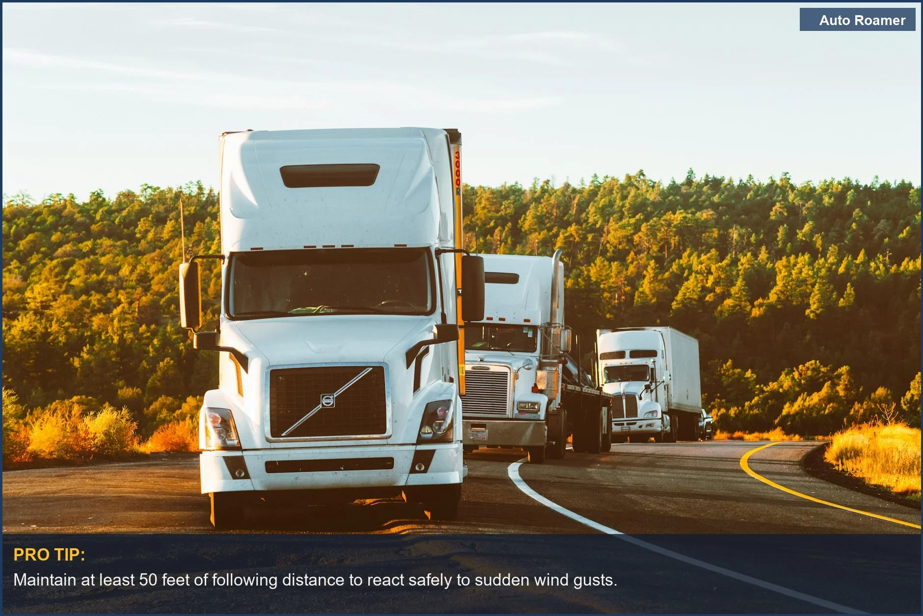 Three semi trucks navigating a highway in Arizona, demonstrating towing trailer in high winds.