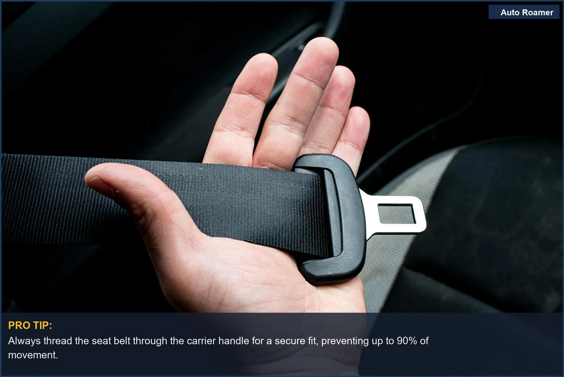 Hand securing a pet carrier handle with a car seat belt for safe pet travel.