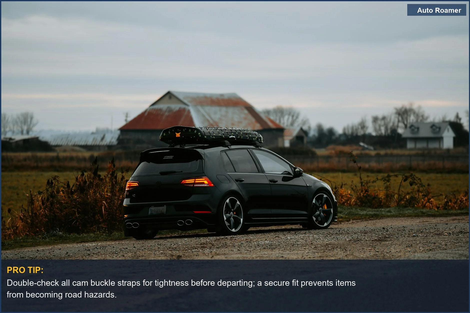 Black hatchback with roof rack parked on a rural dirt road, illustrating proper roof bag safety.
