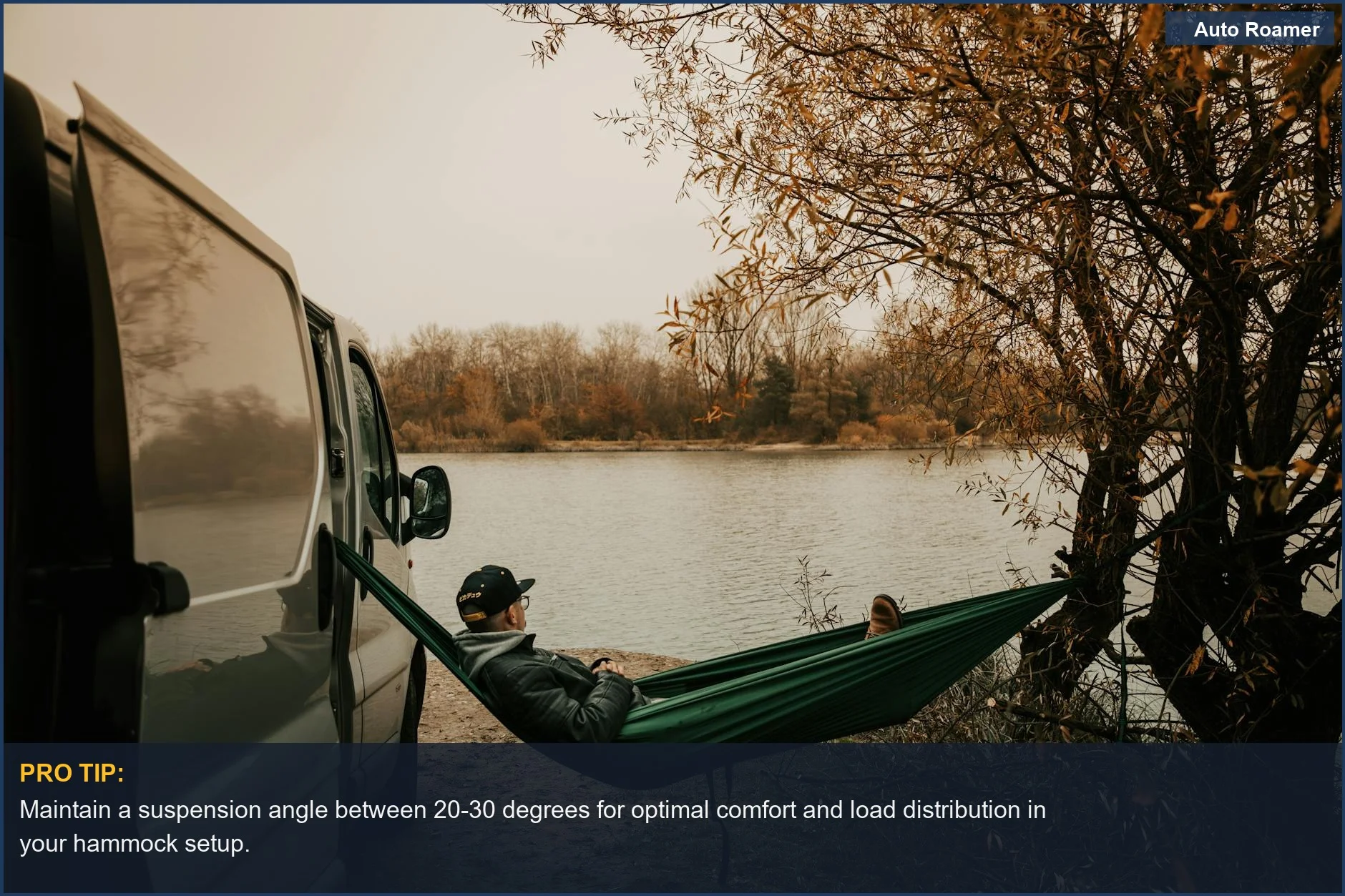 Person relaxing in a hammock next to a van during a tranquil autumn car camping trip.