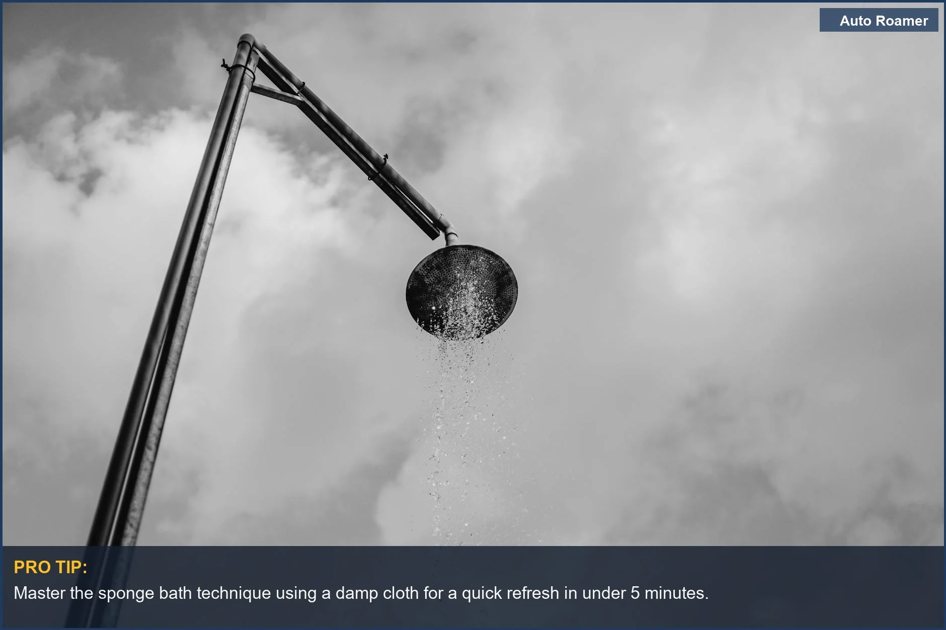 Outdoor shower with water cascading against a dramatic cloudy sky, perfect for car camping hygiene.