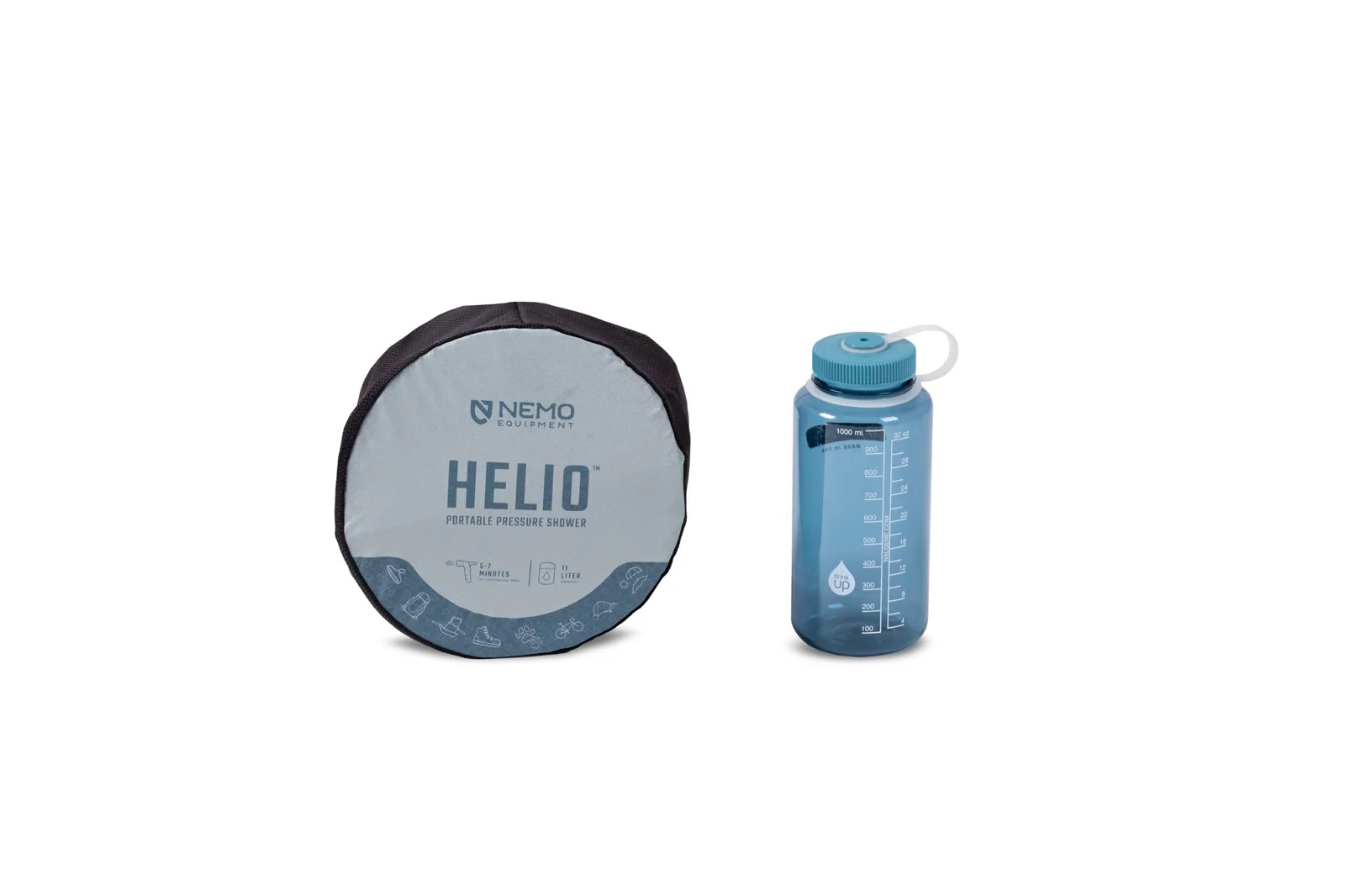 the NEMO Helio pressure shower packed into a small round stuff sack beside a one-liter water bottle for scale