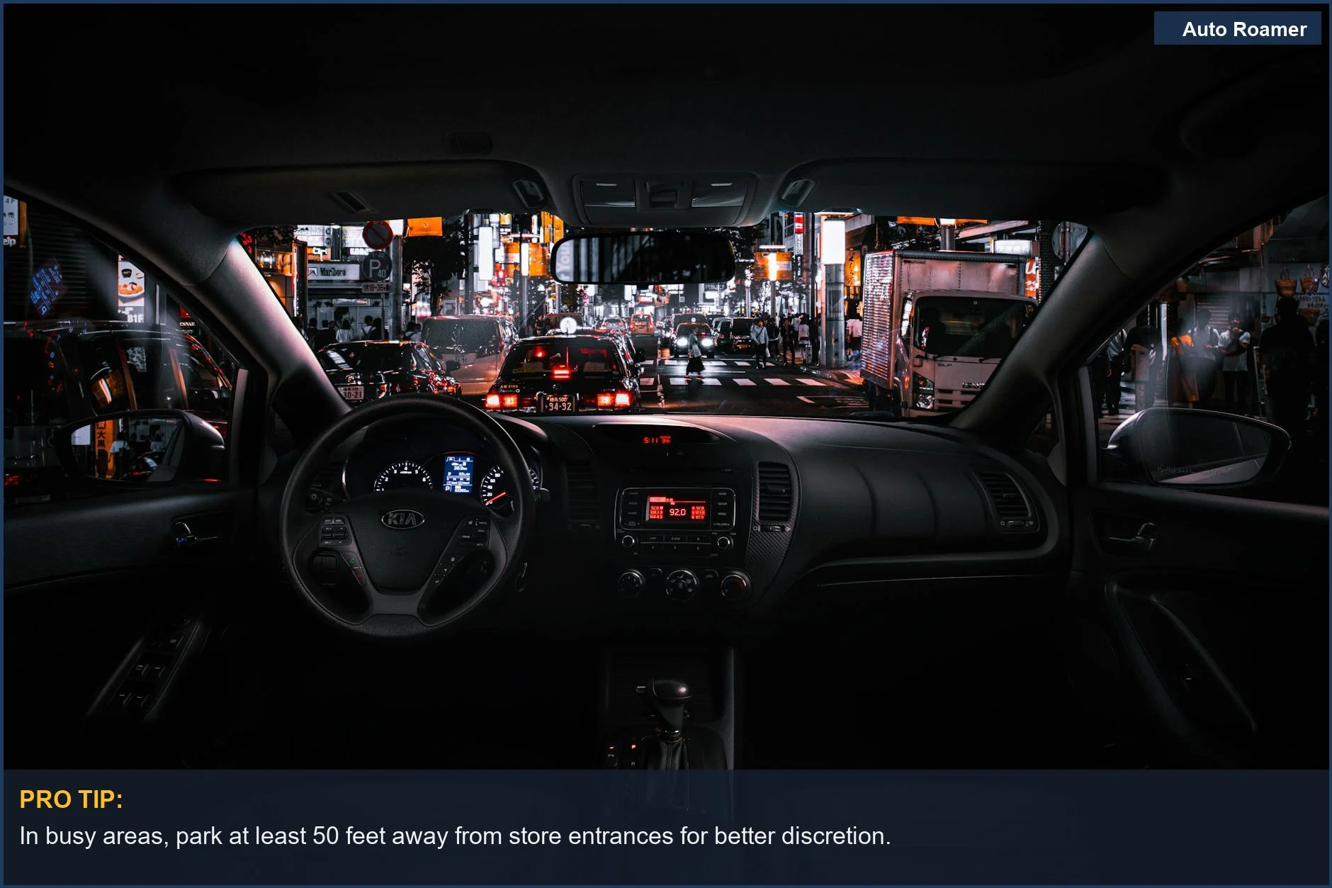 Tokyo cityscape at night from car interior, showing busy traffic and illuminated buildings for overnight parking strategy.