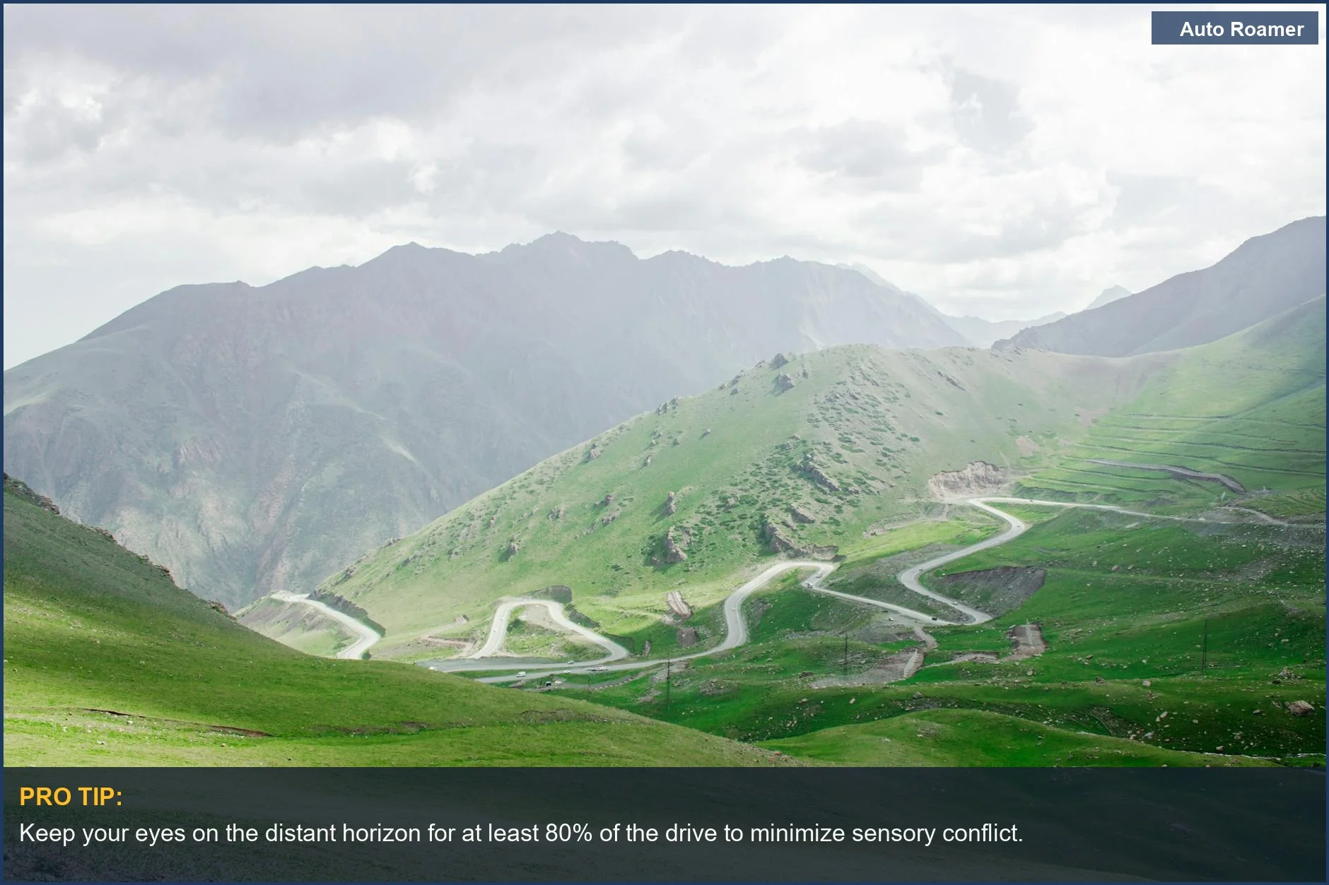 A breathtaking aerial view of a winding road through Kyrgyzstan mountains, illustrating challenges for stopping motion sickness on winding mountain roads.