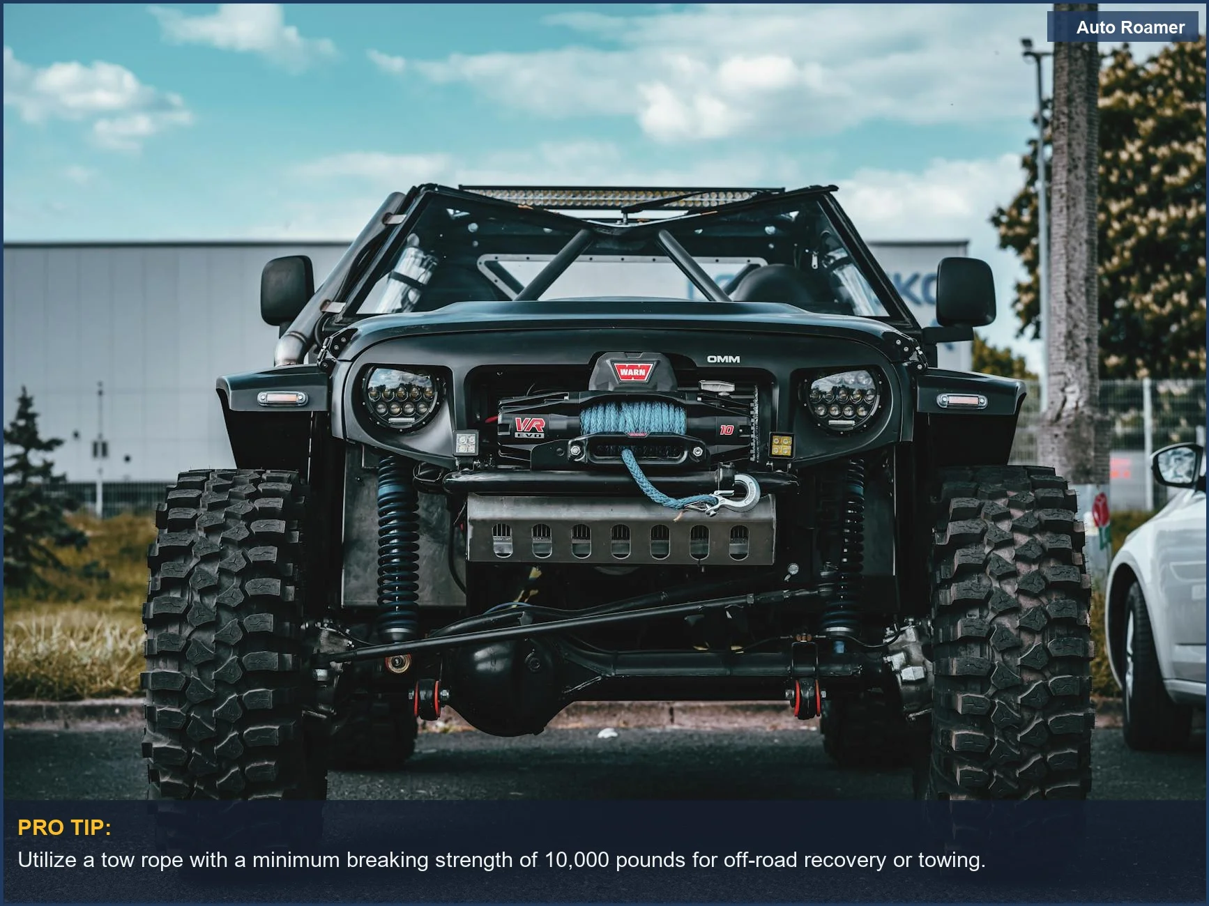 Rugged off-road vehicle with a prominent tow rope, ready to tow car yourself.