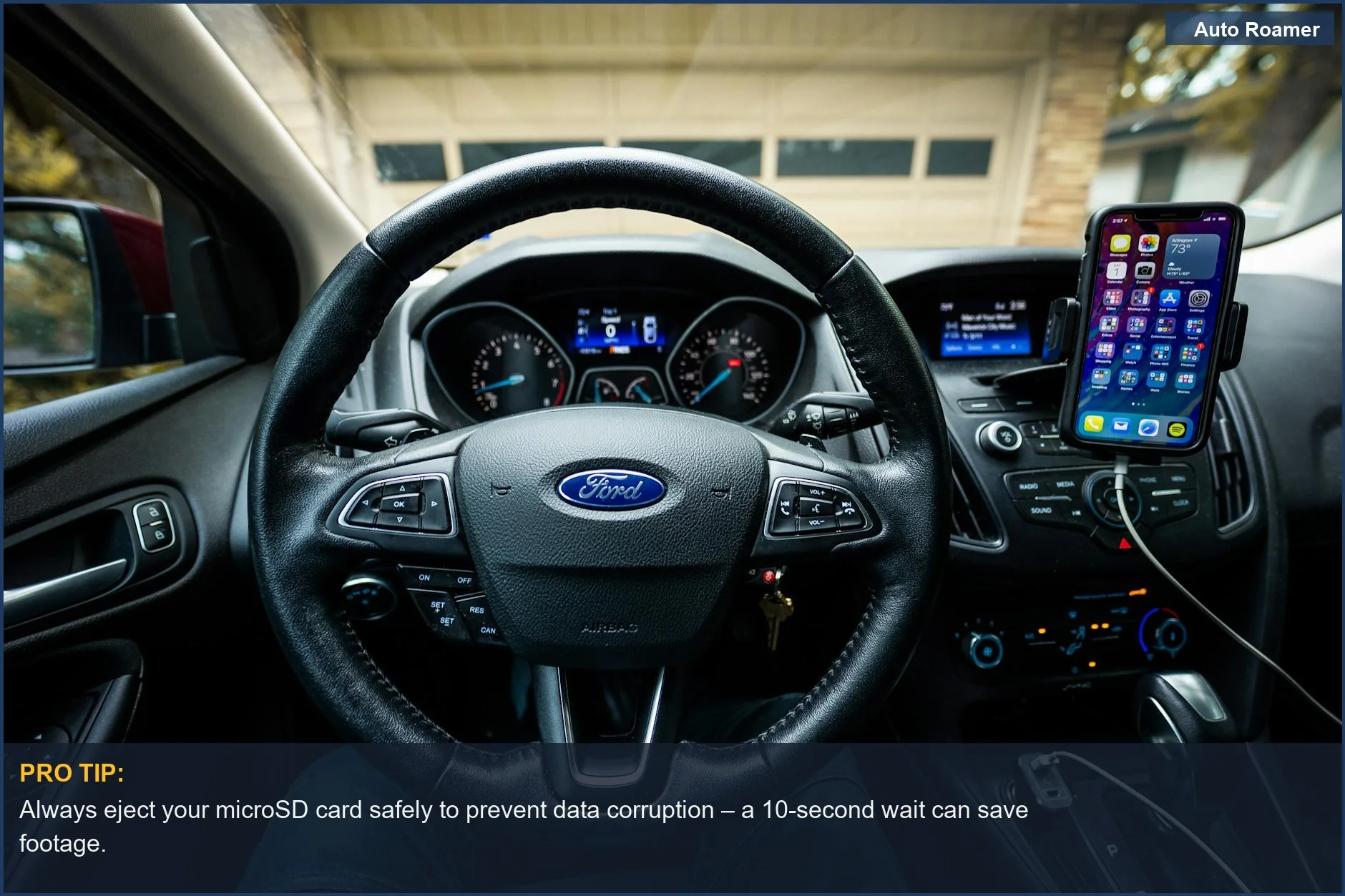 An interior view of a Ford car dashboard with a steering wheel and mobile mount, perfect to move dashcam recordings to your phone.