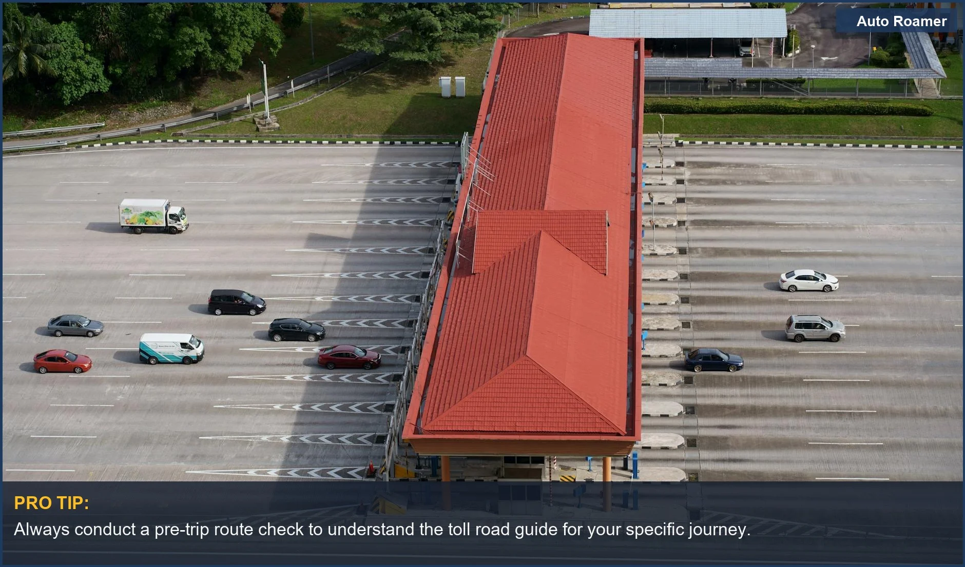 Aerial view of a busy toll plaza with cars and trucks, a key part of any toll road guide.