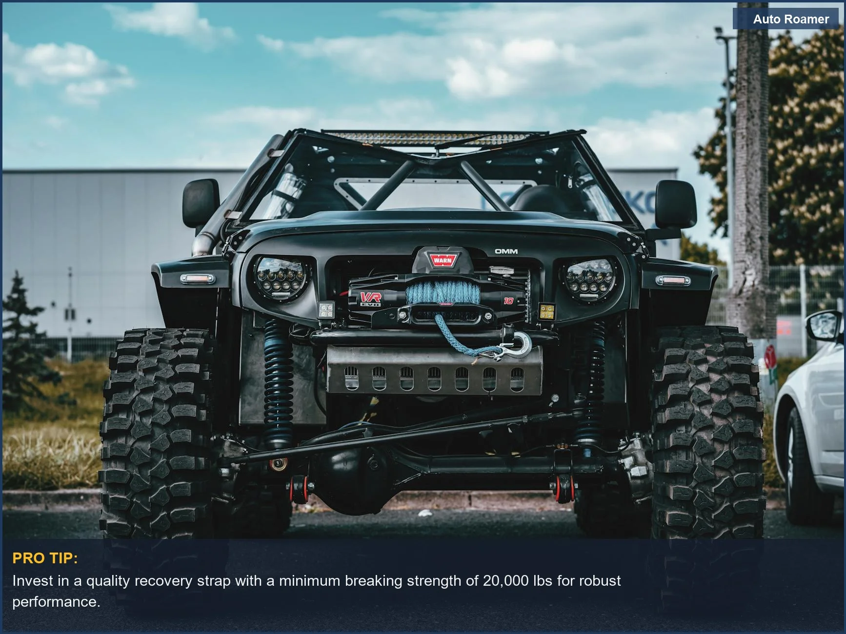 Close-up of a rugged off-road vehicle's tow rope, highlighting essential gear for stuck vehicle situations.