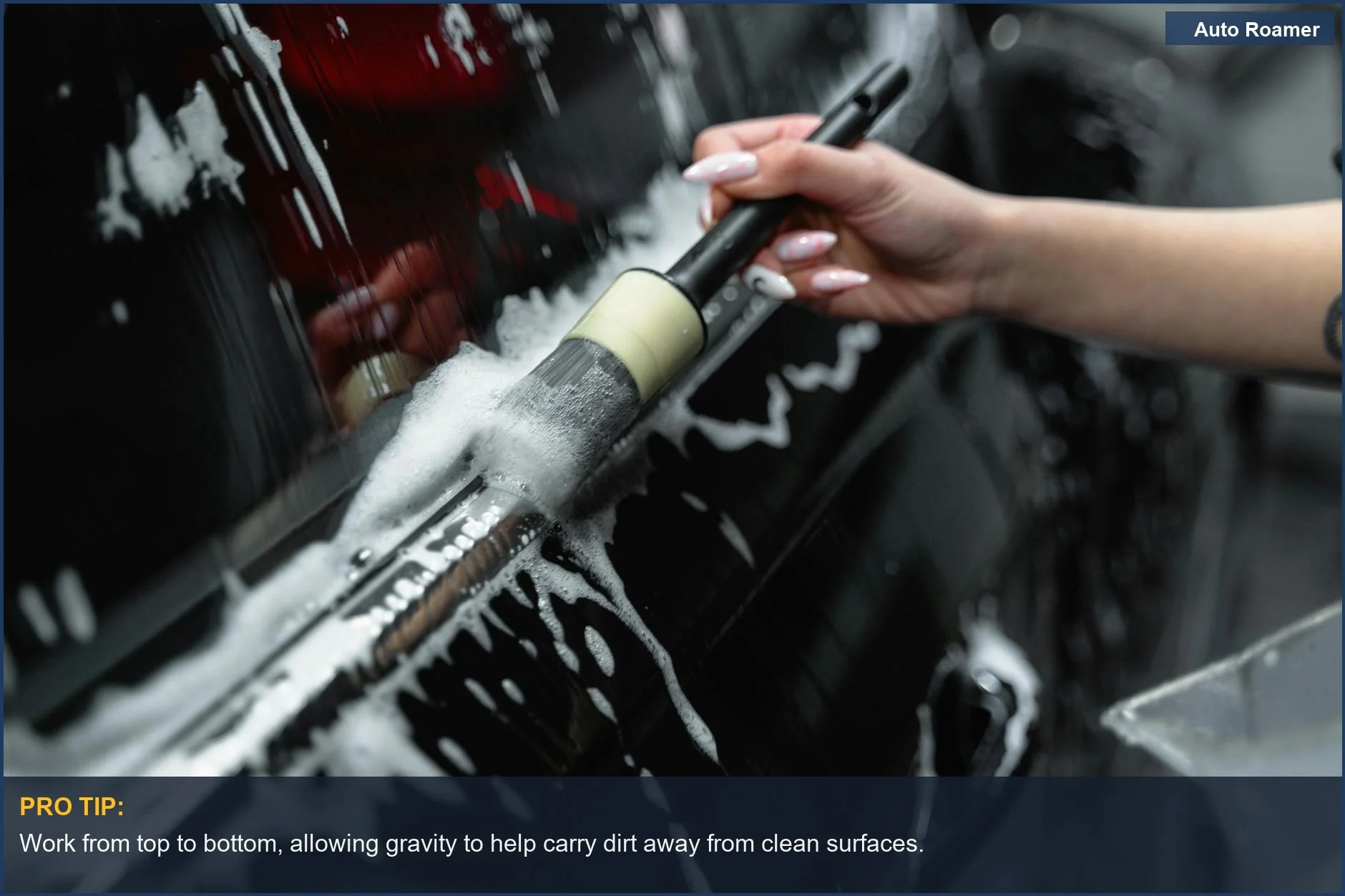 Car being washed with suds and brush, a visual of washing your car without scratching.