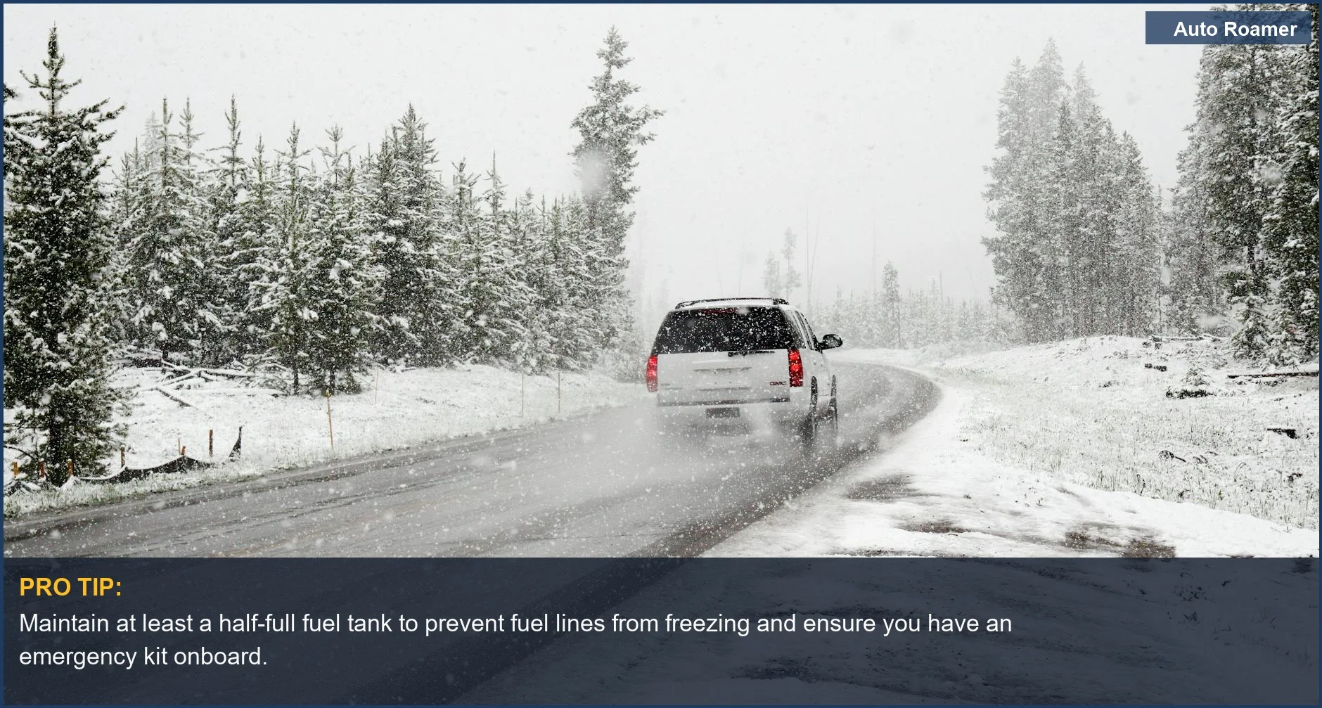 A lone car drives through a snowstorm on a tree-lined road, emphasizing the importance of getting your vehicle ready for cold weather.